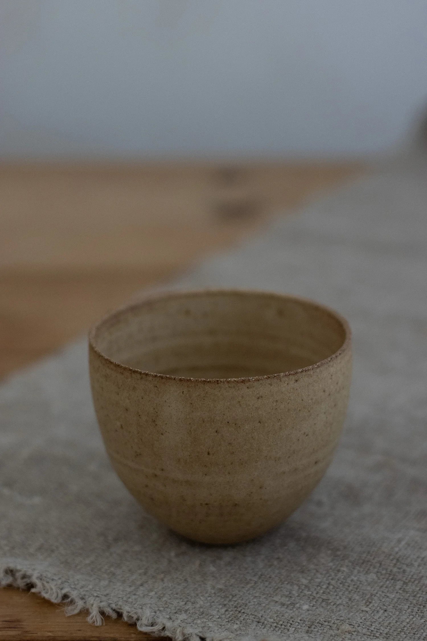 Curved Cup in Hay Glaze by Blanc Ceramics - Lifestory