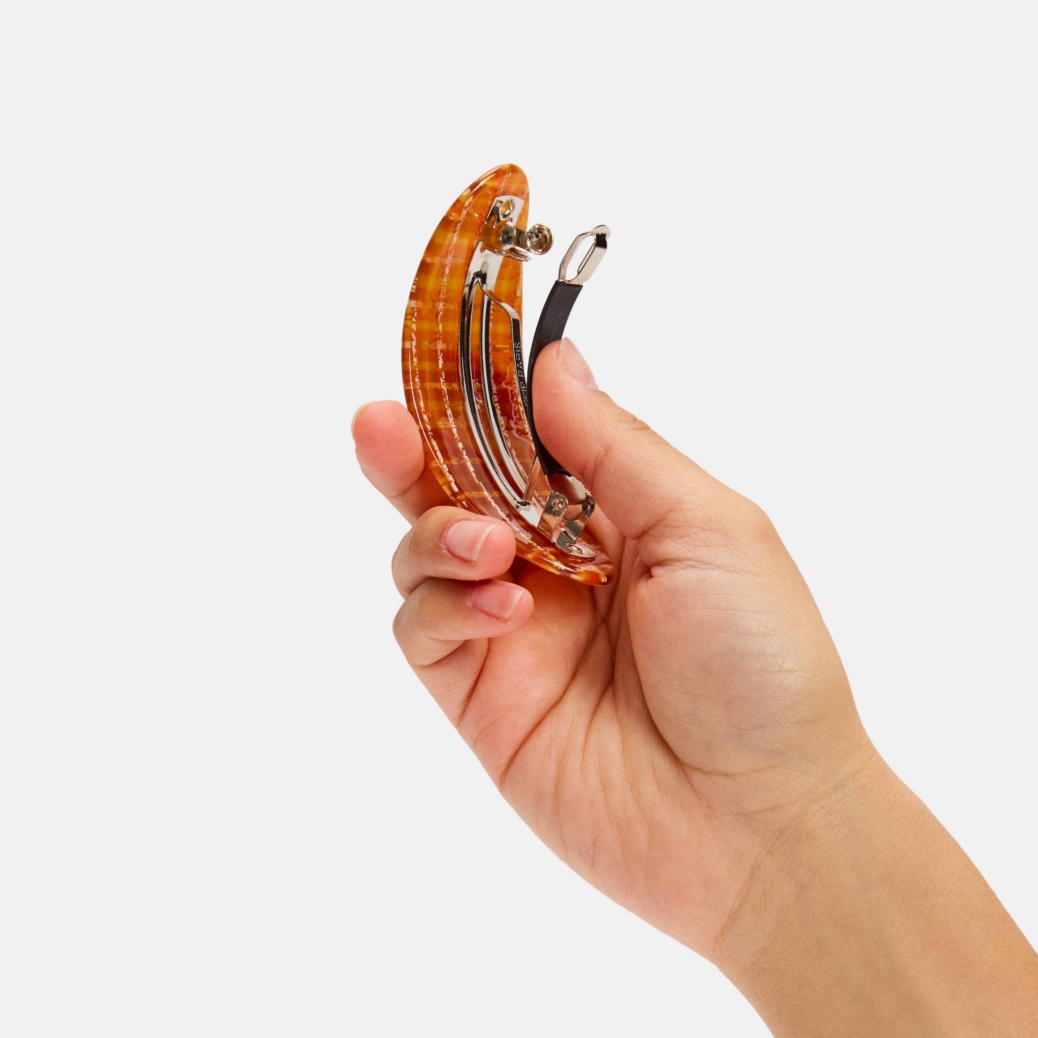 CHUNKS Oval Barrette in Caramel Plaid being held up to show the metal clasp underside