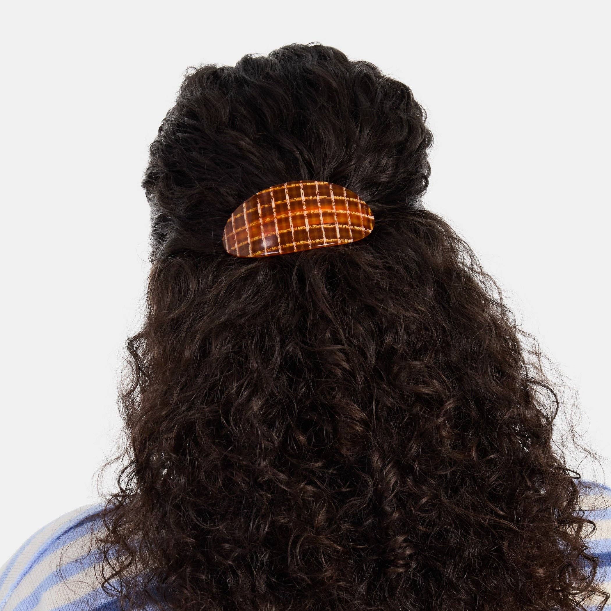 CHUNKS Oval Barrette in Caramel Plaid being worn in a half up hold by a model against a white background
