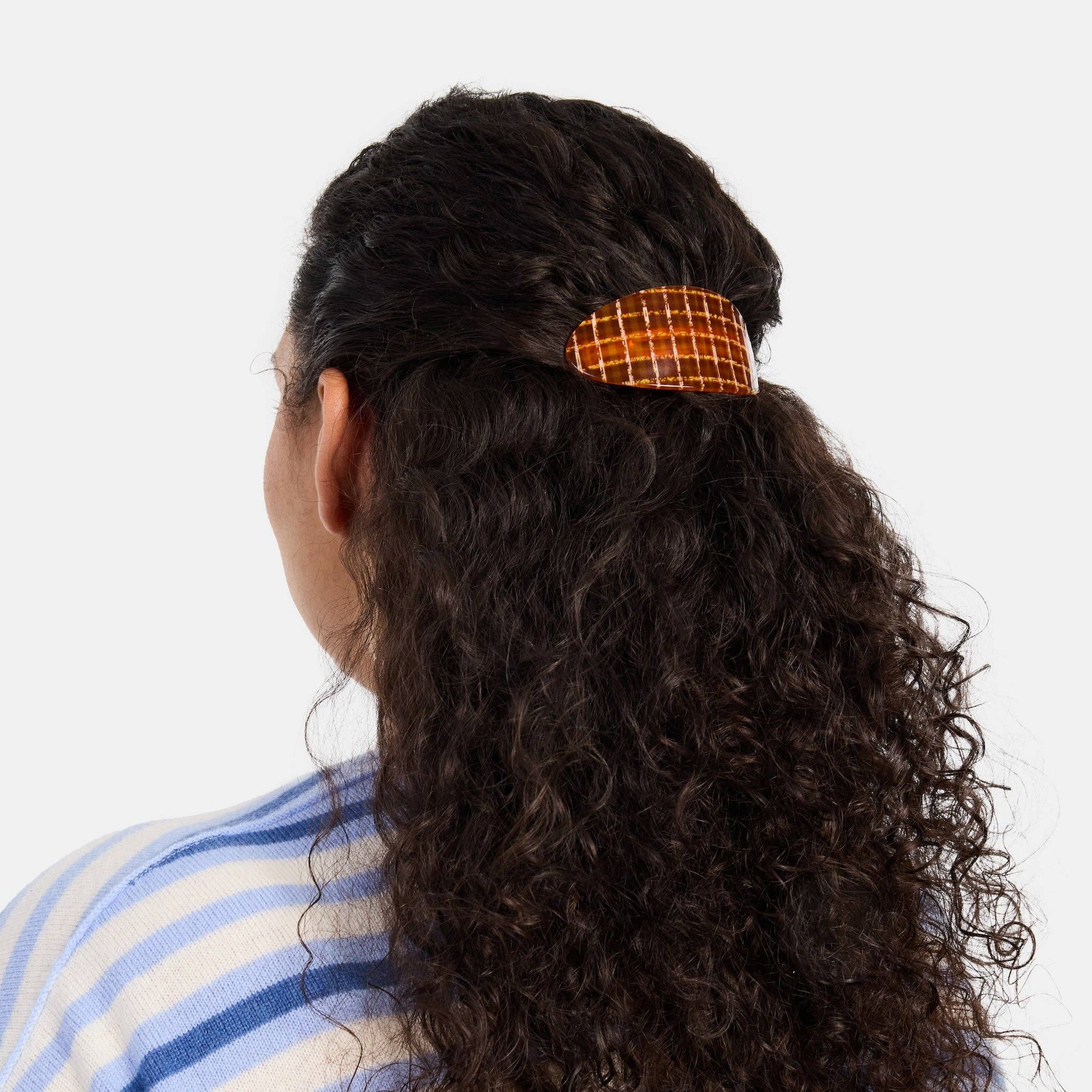 CHUNKS Oval Barrette in Caramel Plaid being worn in a half up hold by a model against a white background