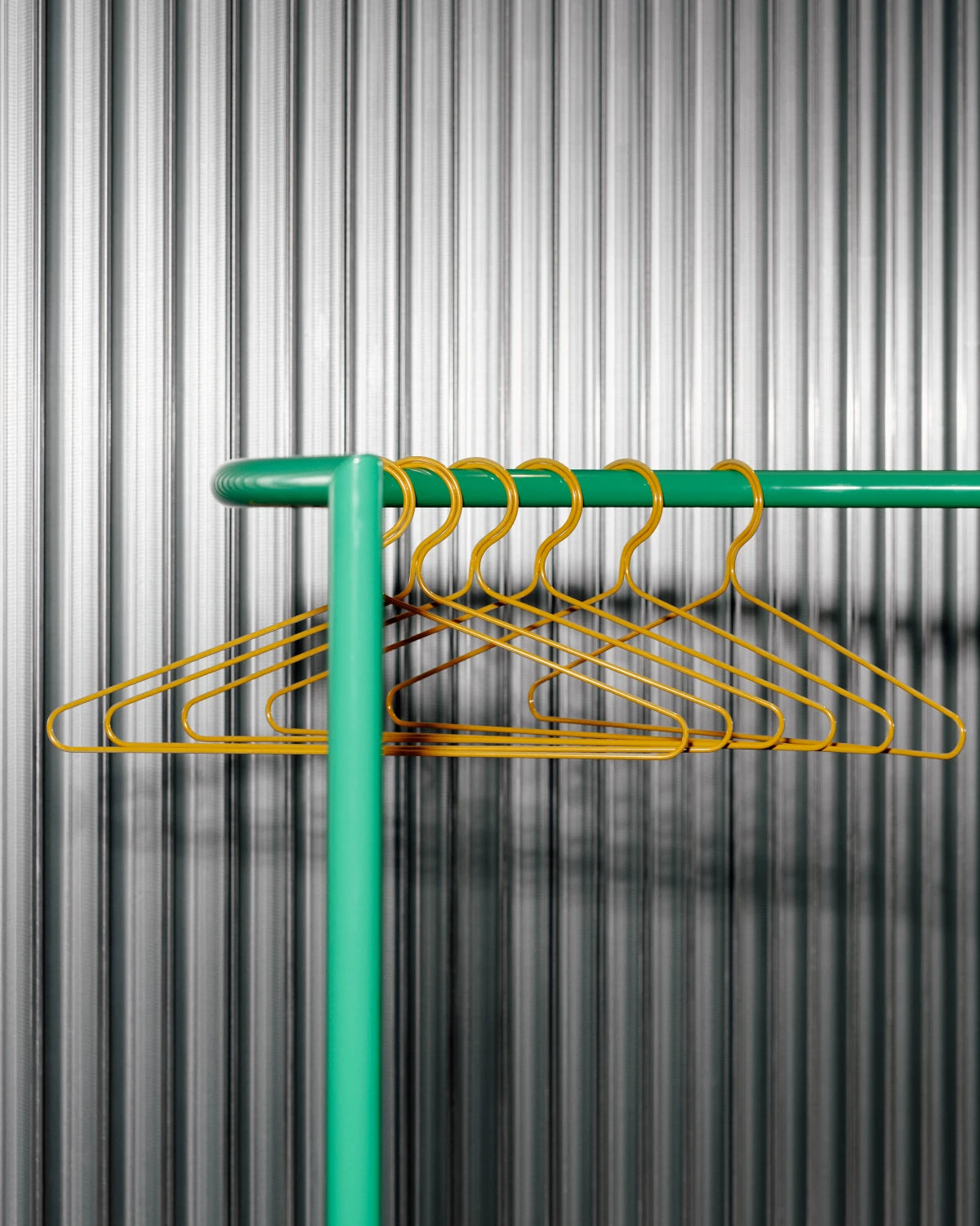 Set of 3 Colour Hangers in Dijon by HAY on a coat stand | Lifestory