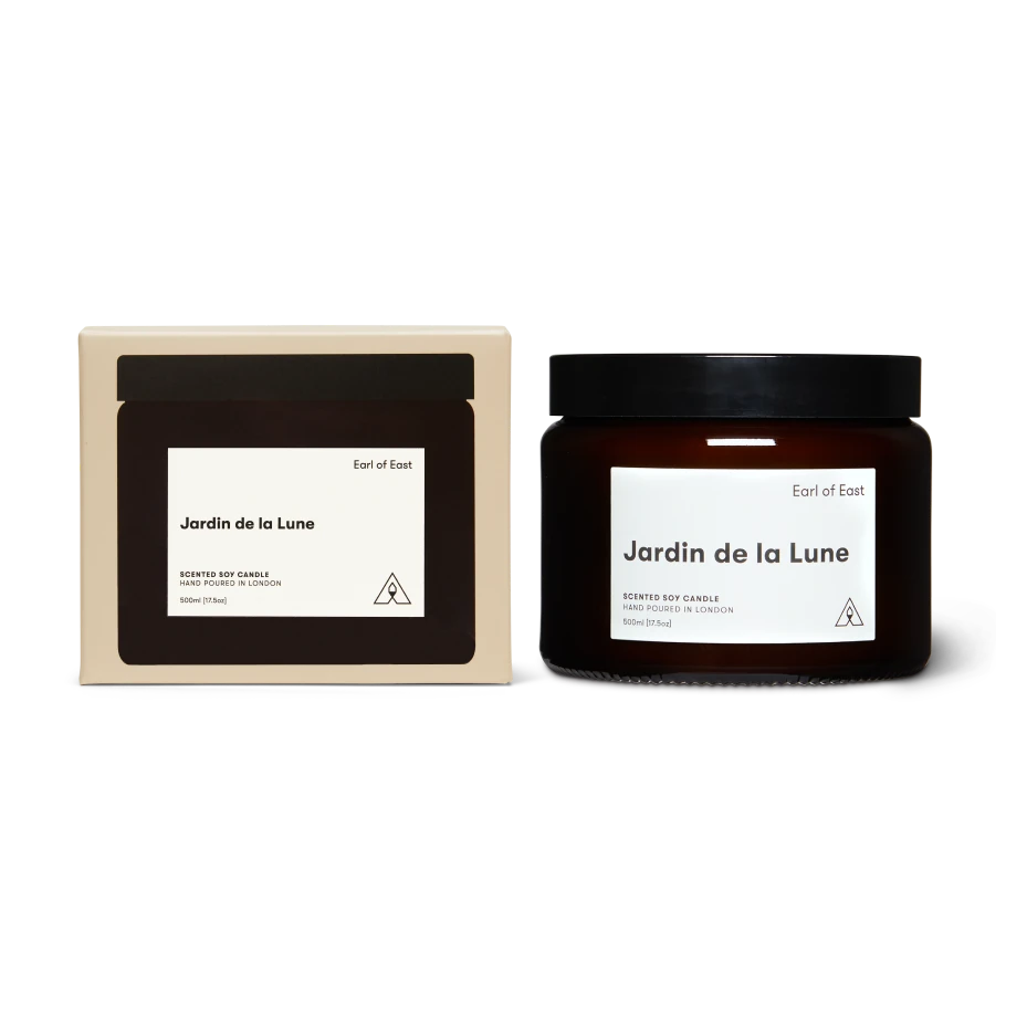 Jar and packaging of 'Jardin de la Lune' candle by Earl of East on a white background