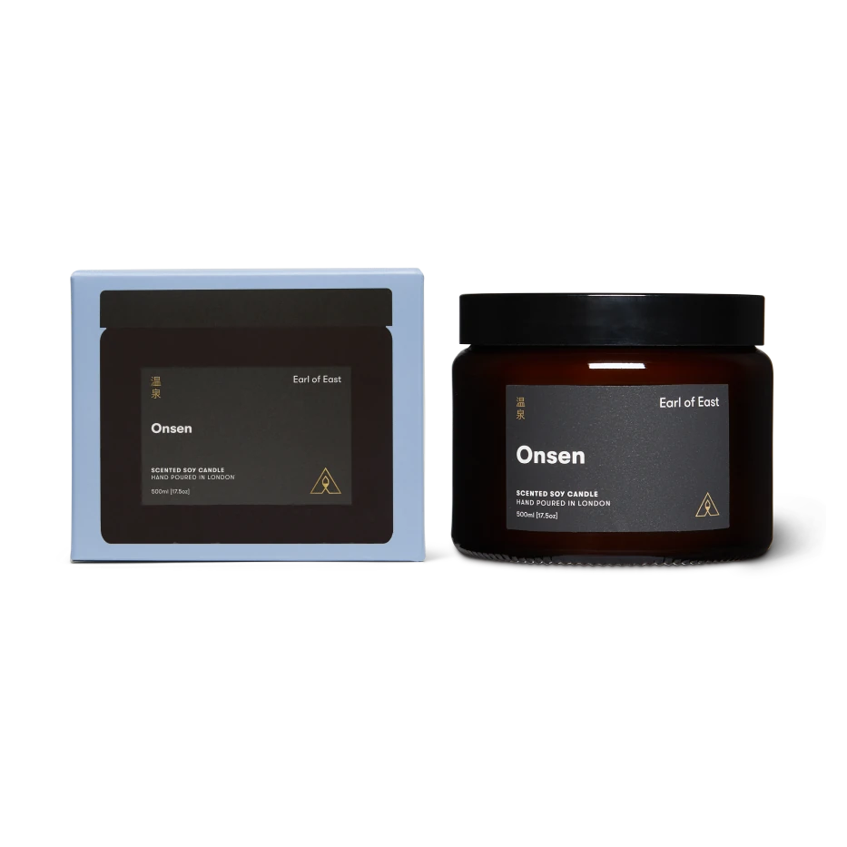 Onsen scented soy candle with packaging on a white background