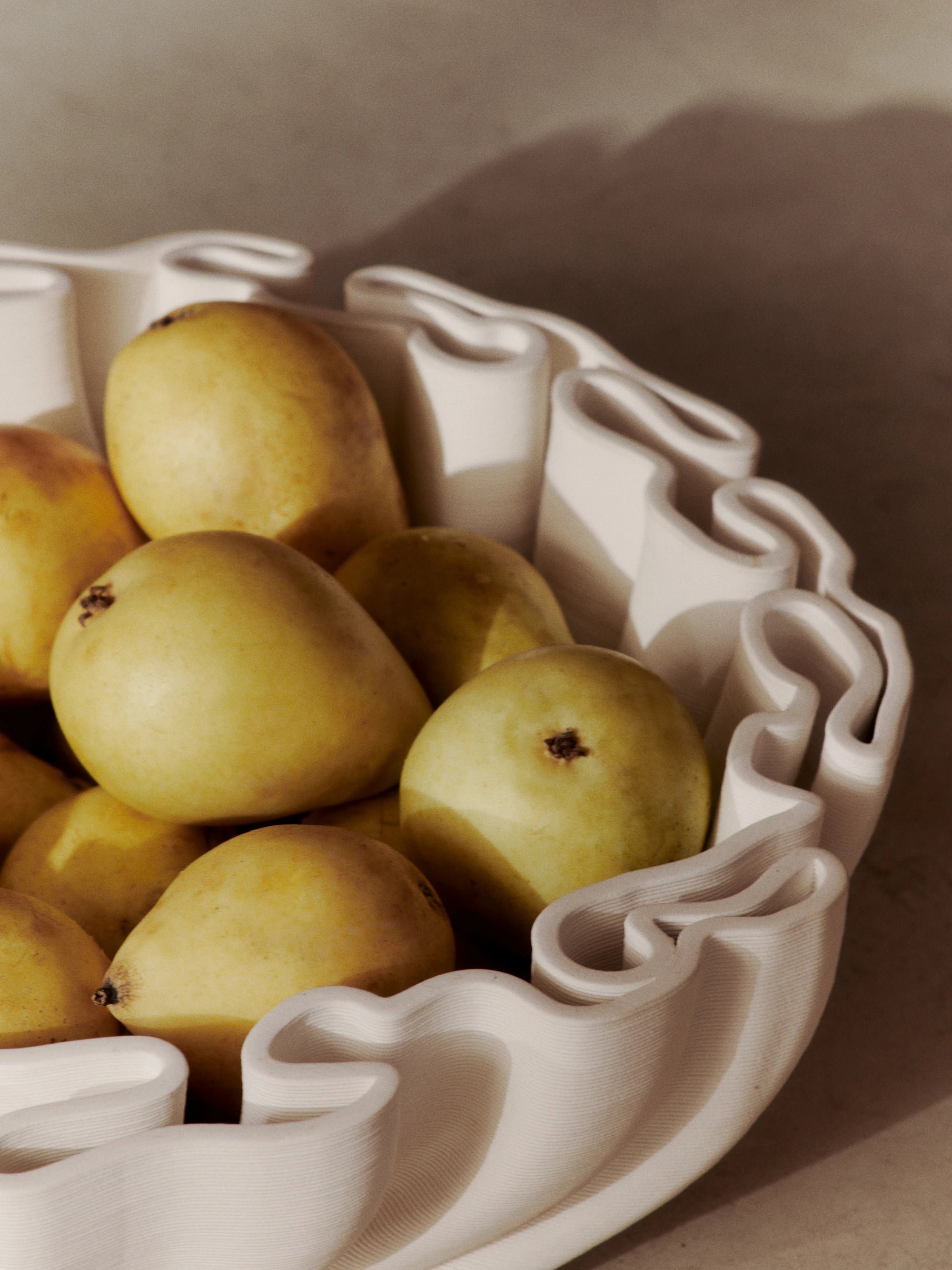 Ferm Living Dedali Bowl in Off-White 3D Printed Stoneware filled with pears