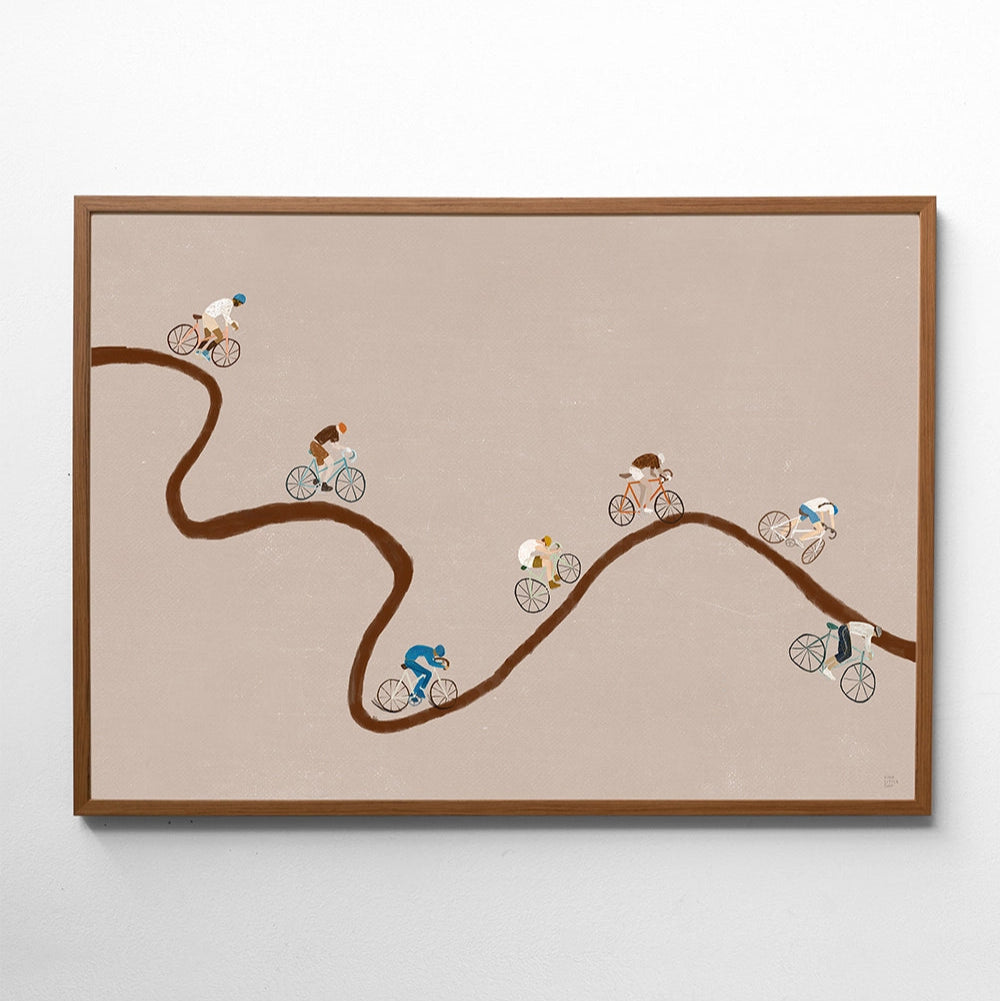 Framed artwork of cyclists on a winding road on a beige background