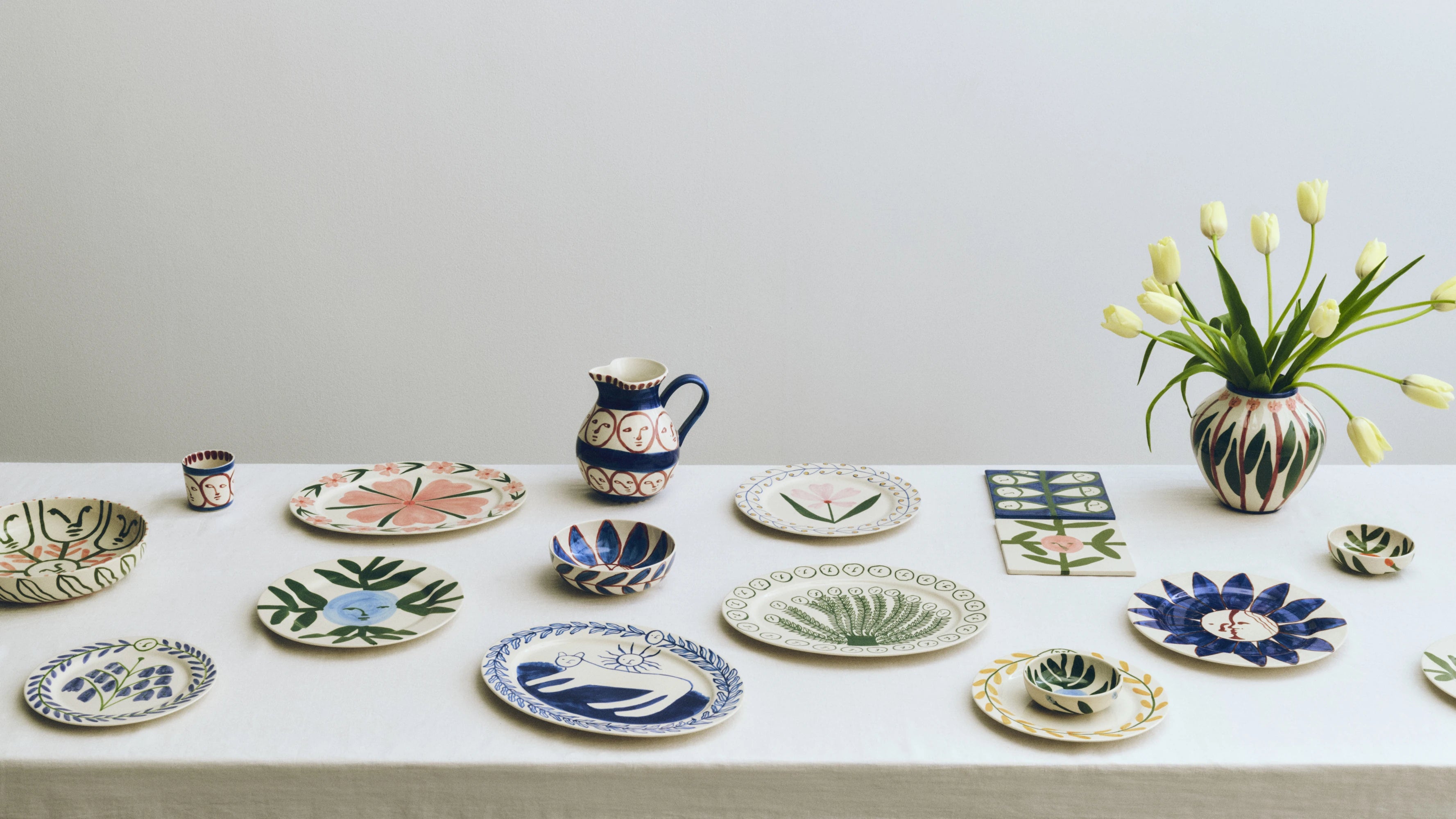 HAY x Emma Kohlmann - La Pittura collection laid on a white tableclothed table