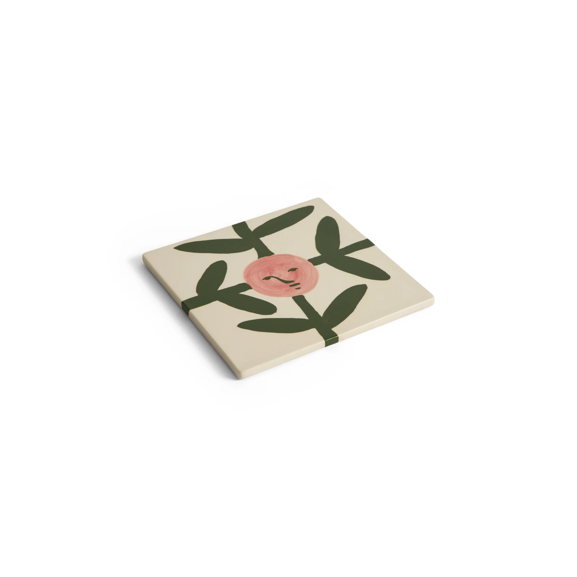 HAY x Emma Kohlmann - La Pittura Trivet in Blush Face Vine design at an angle