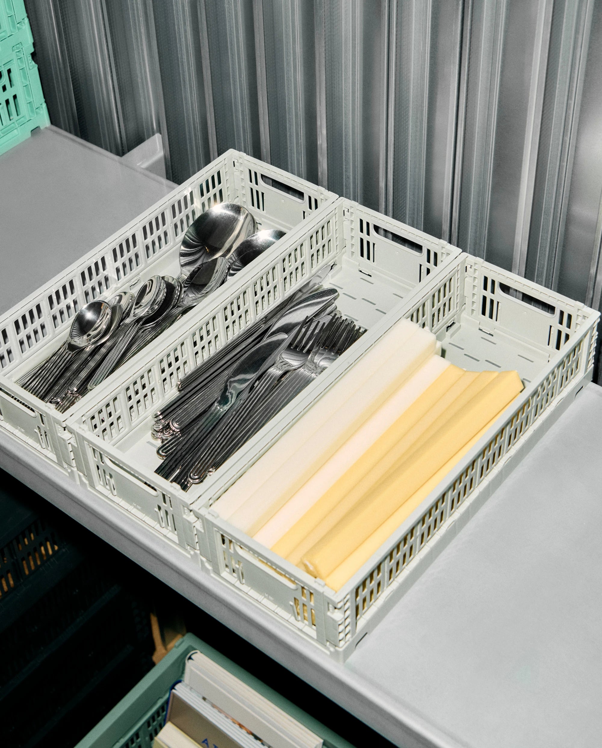 HAY colour crates with cutlery and paper on a grey surface | Lifestory