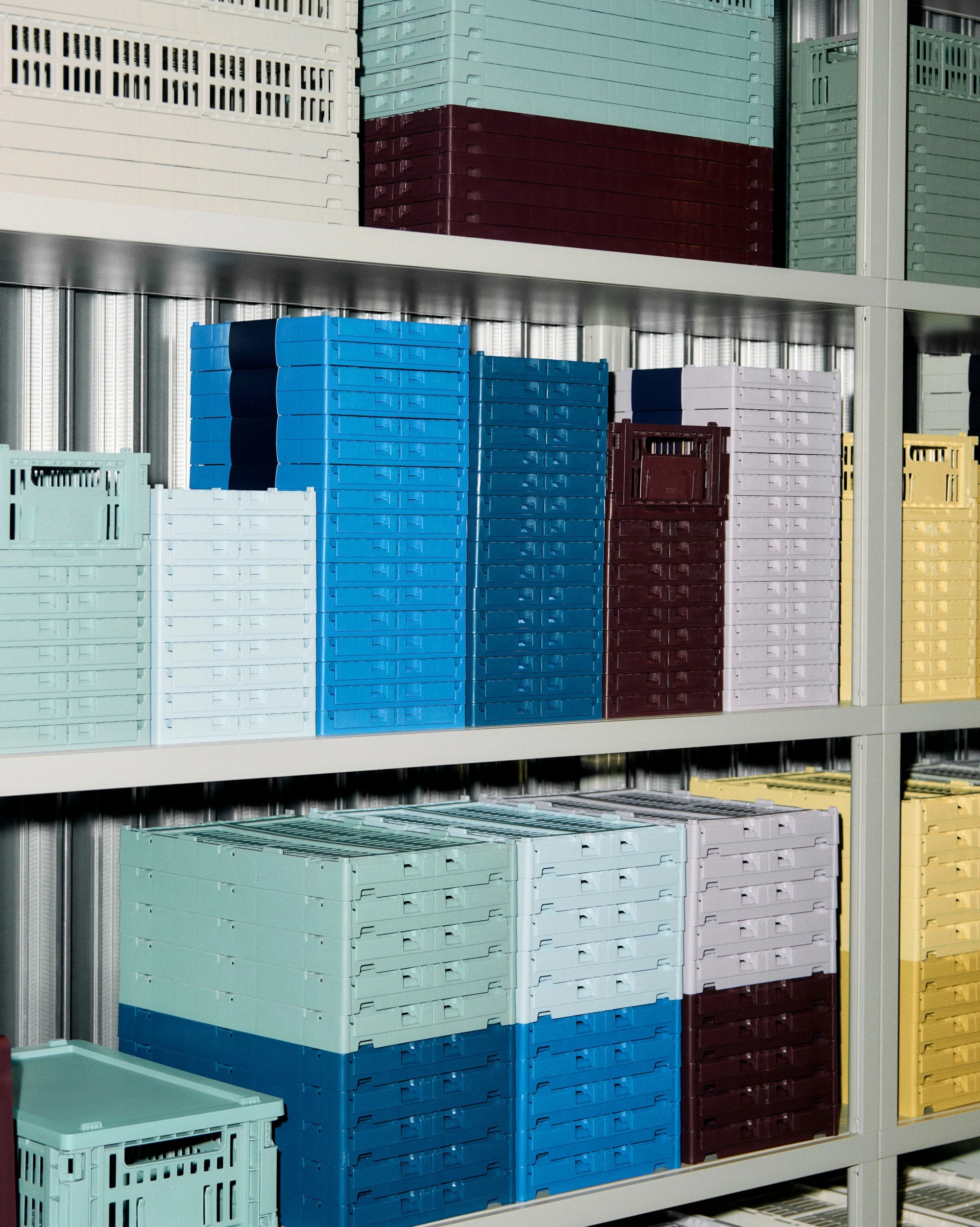 Stacked colorful HAY colour crates on a metal shelf | Lifestory