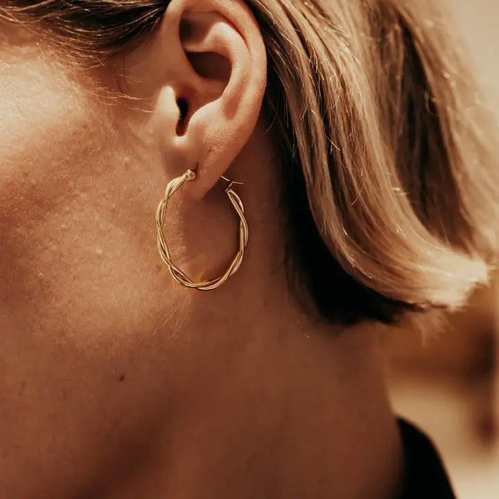 Gold Large Entwined Hoop Earrings on models ear by Nordic Muse at Lifestory