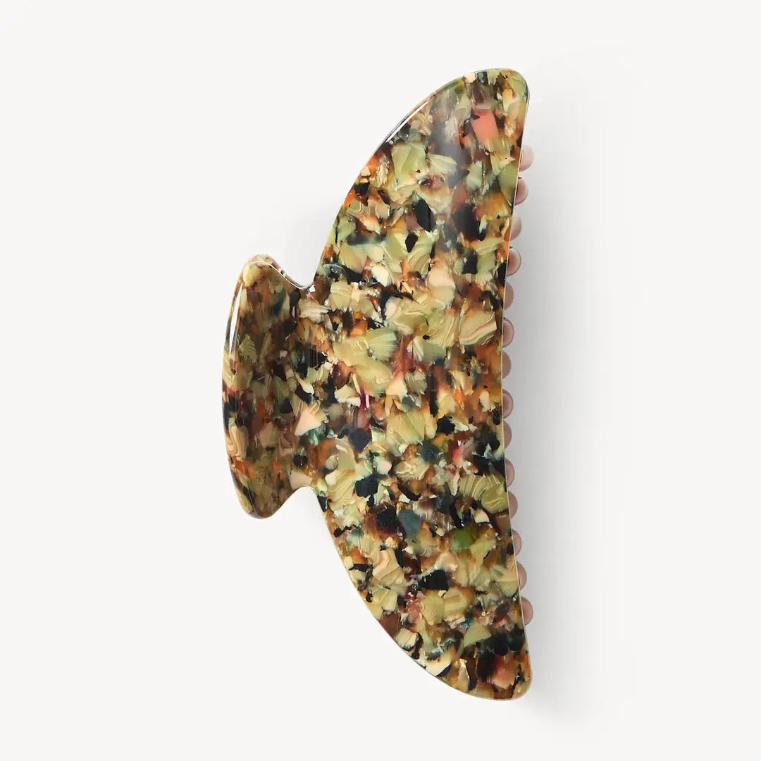 Machete hair claw with Monet pattern colourways in greens and browns on a white background