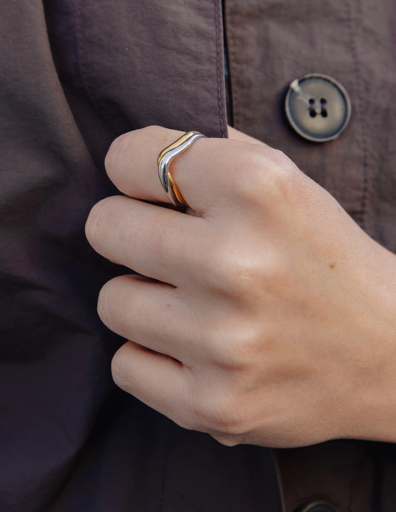 Gold & Silver Entwined Ring - Water Resistant Plating by Nordic Muse being worn by a model