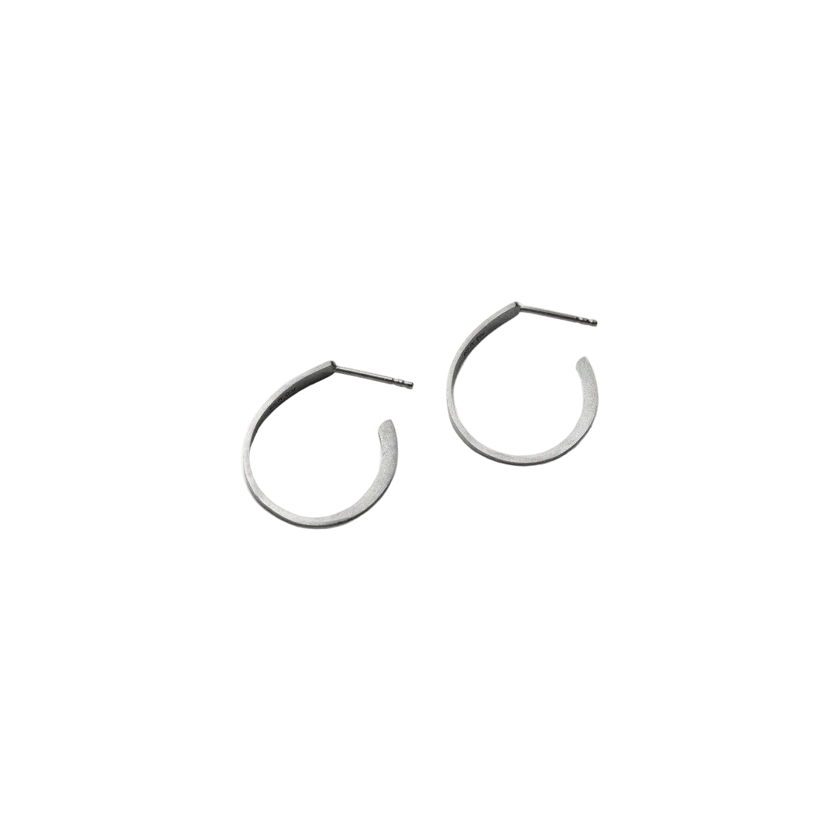 Pair of oxidised silver hoop earrings on a light background