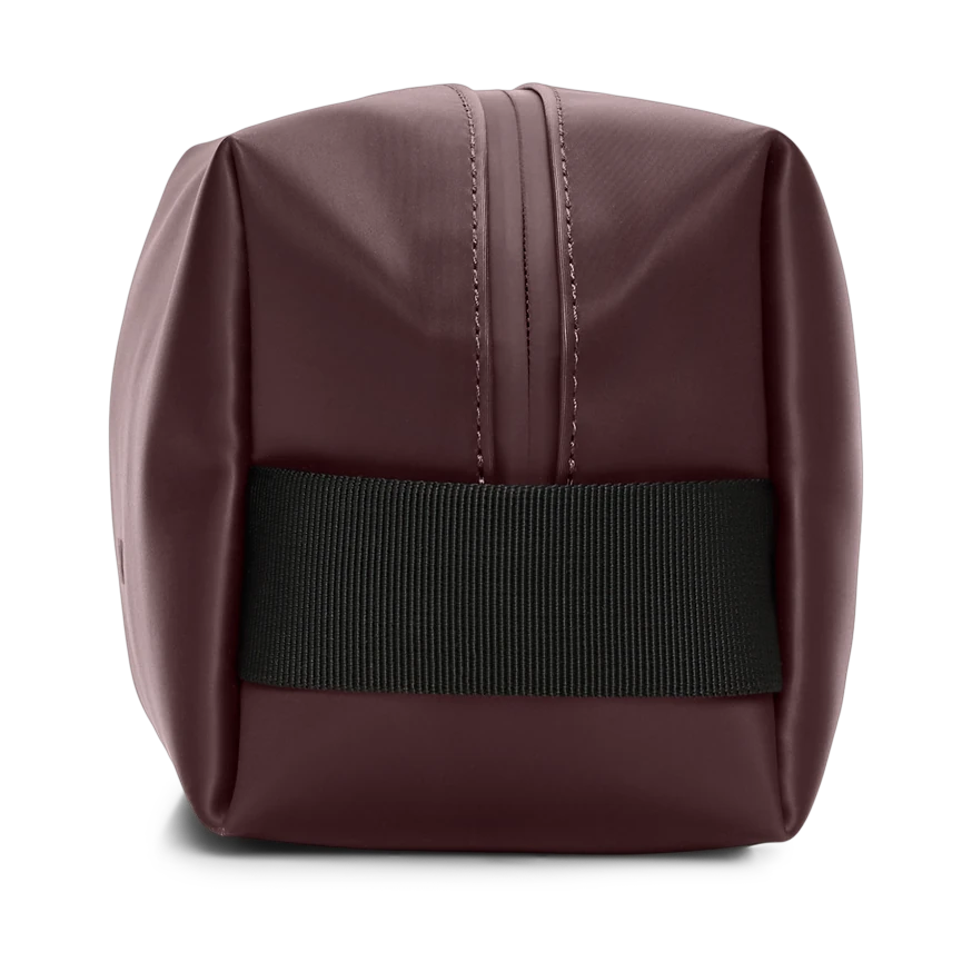 Rains Small Wash bag side view with logo in Depth brown shade