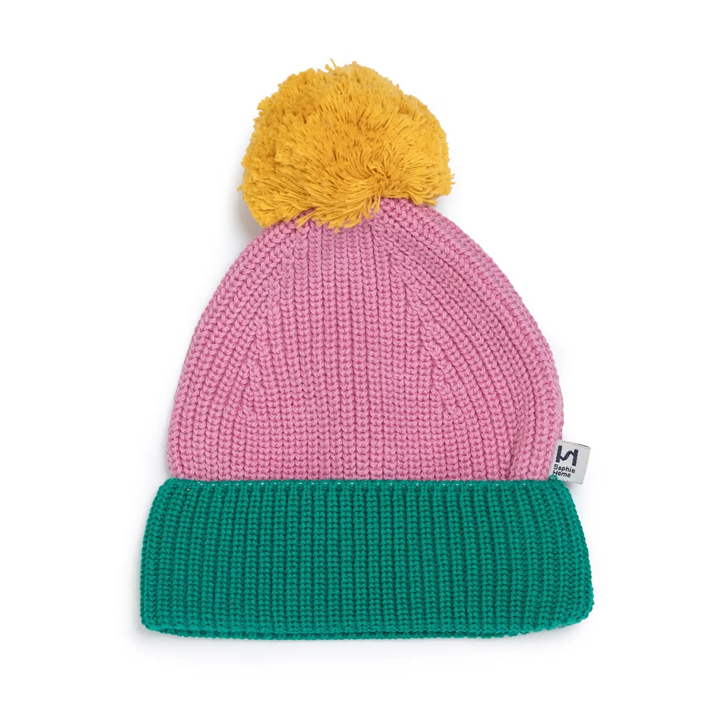 Color-blocked knit beanie with pink top, yellow pom-pom, and green base on a white background