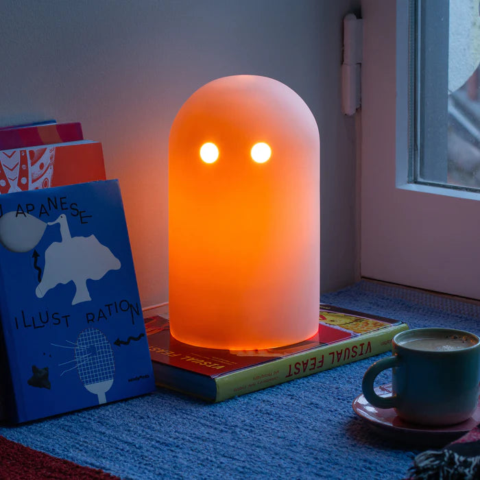 Studio Arhoj Ghost Lamp lit on a desk