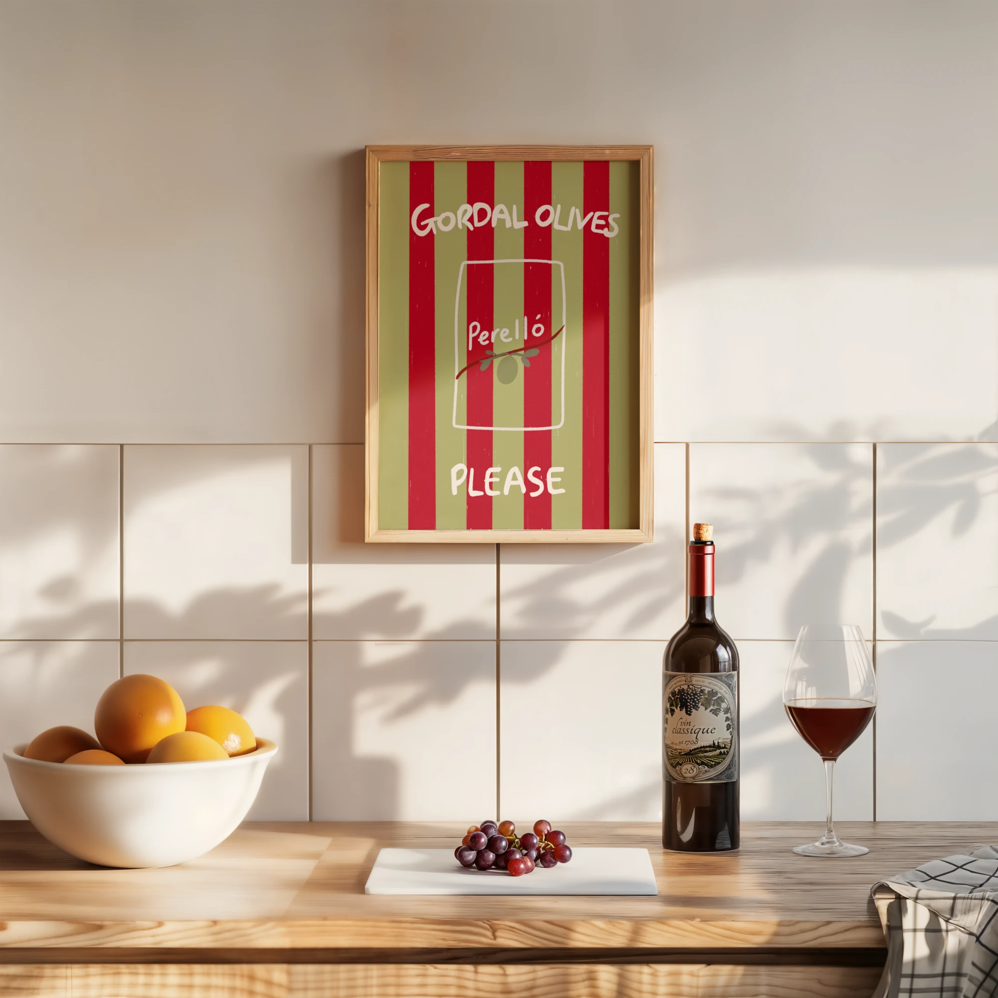 Tecari Designs 'Gordal Olives Please' A3 Unframed Print in a wooden frame hanging above a kitchen worktop