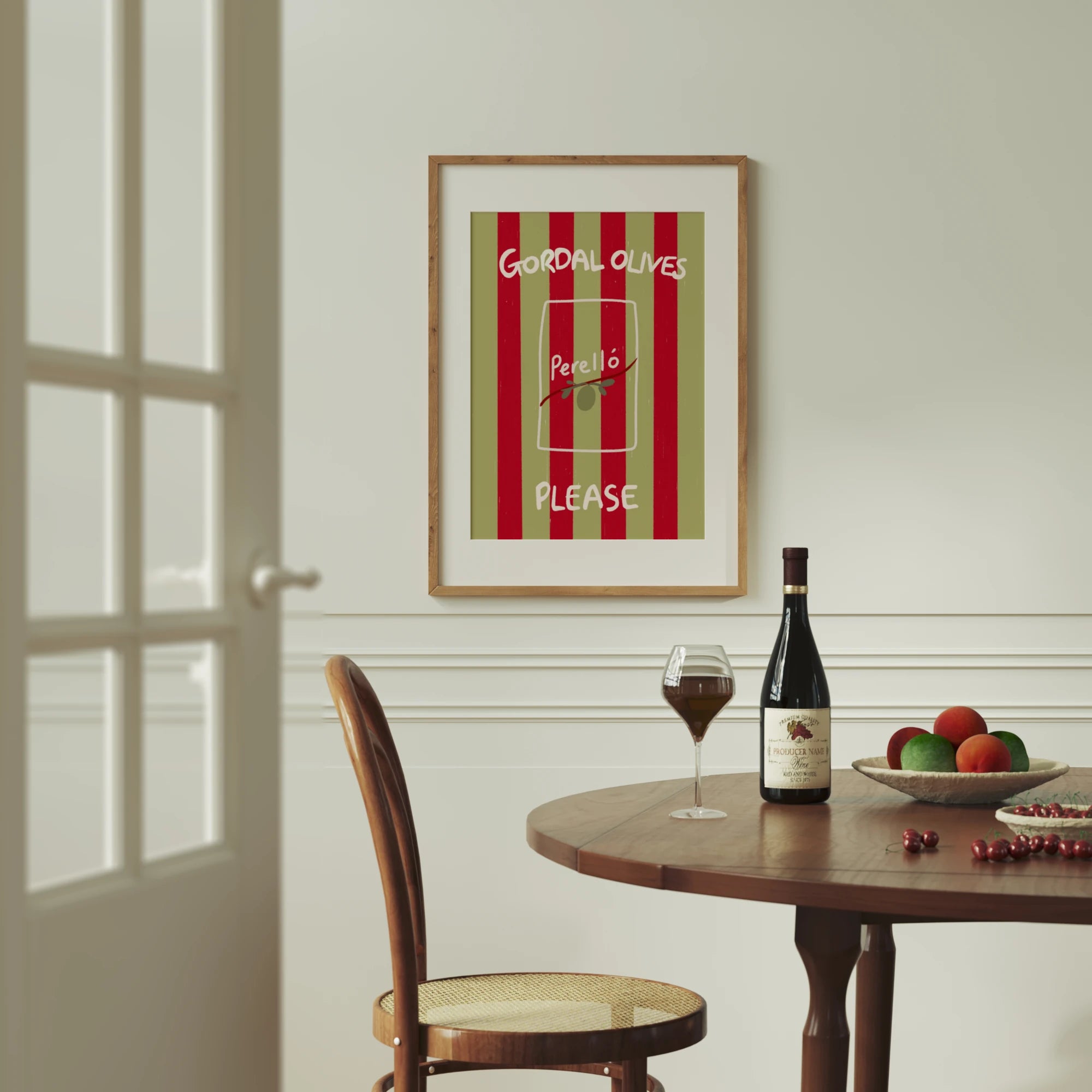 Tecari Designs 'Gordal Olives Please' A3 Unframed Print framed and hanging above a dining table with a bottle and glass of red wine
