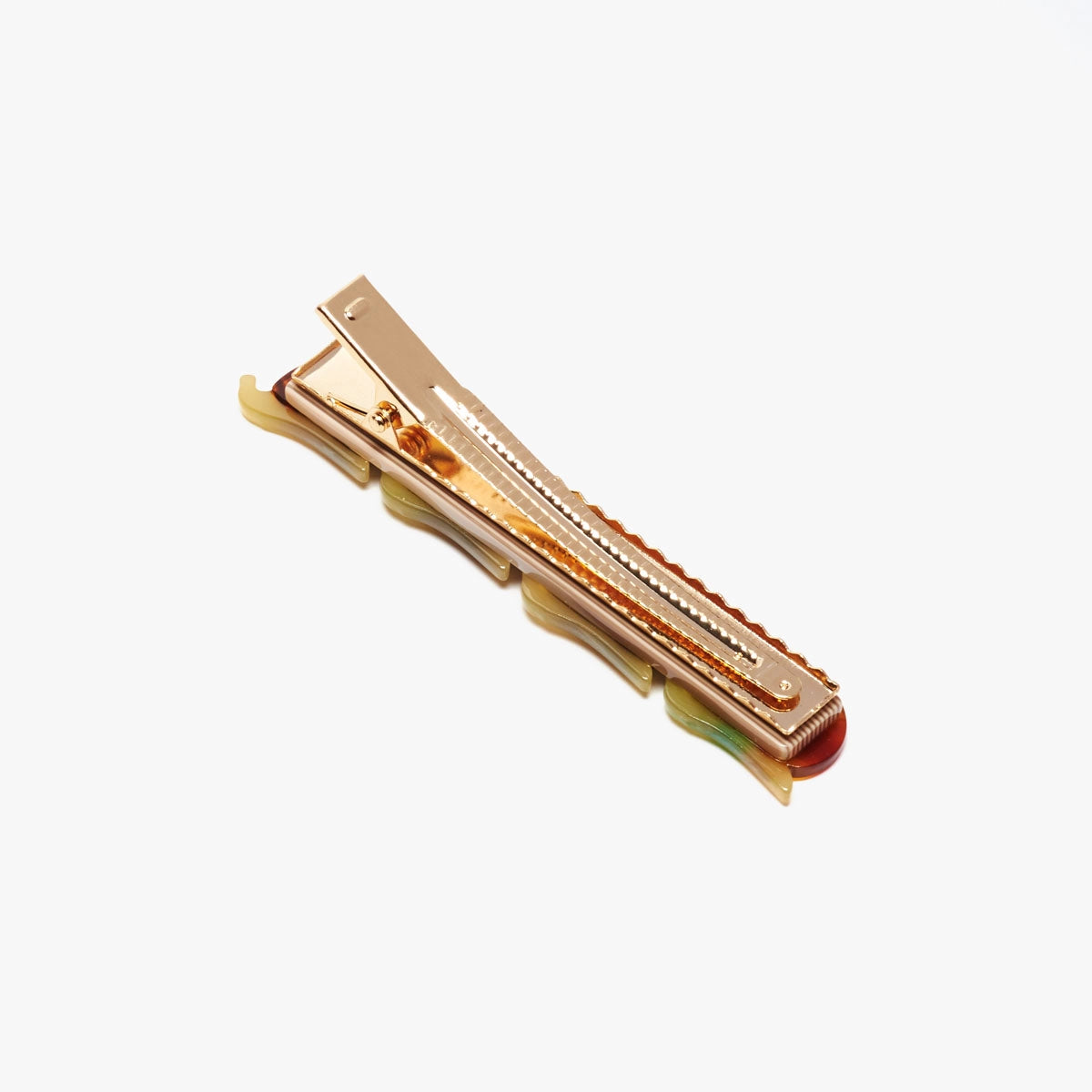 Winona Irene Escargot Snail Alligator Hair Clip seen on the reverse view to highlight the gold clip