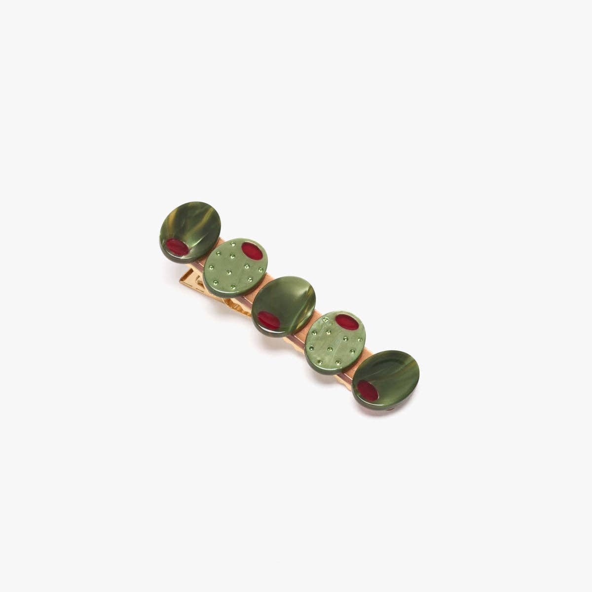olive patterned hair clip with red accents on a white background