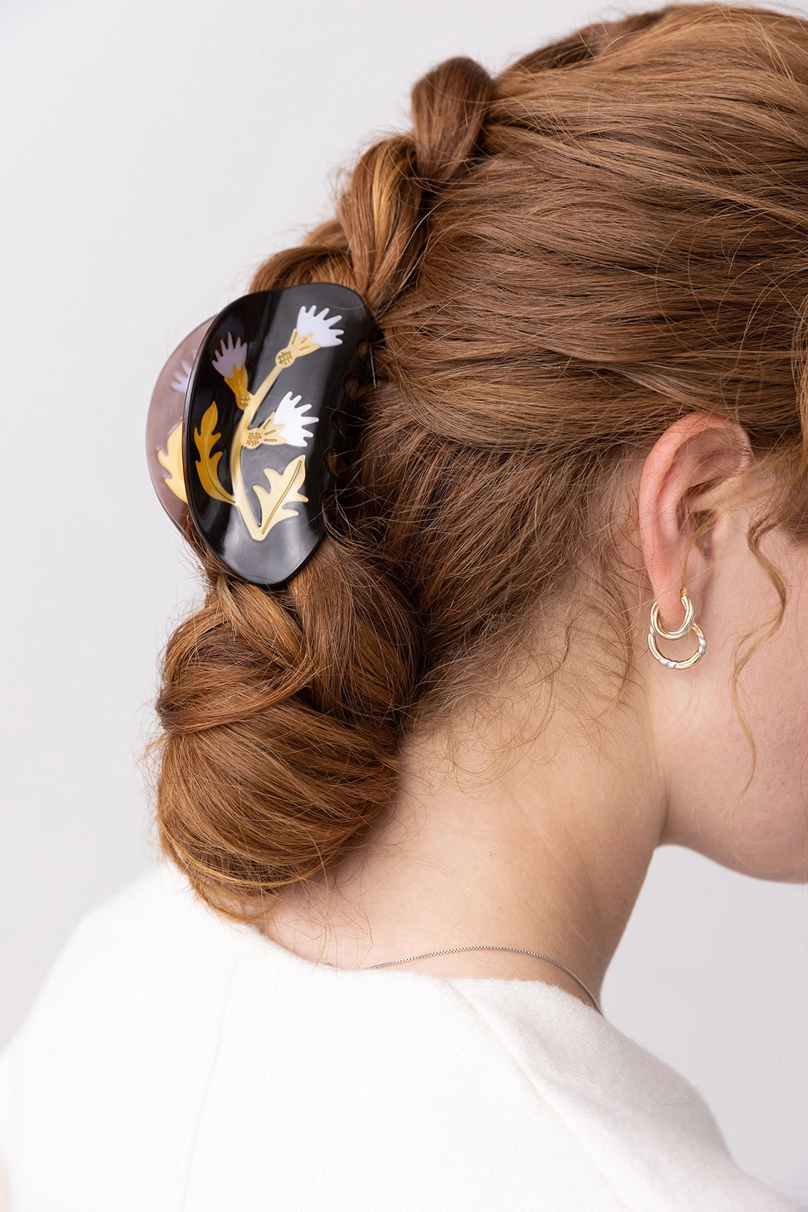 Winona Irene Milk Thistle Acetate Hair Claw being worn by a model with long auburn hair in a low bun
