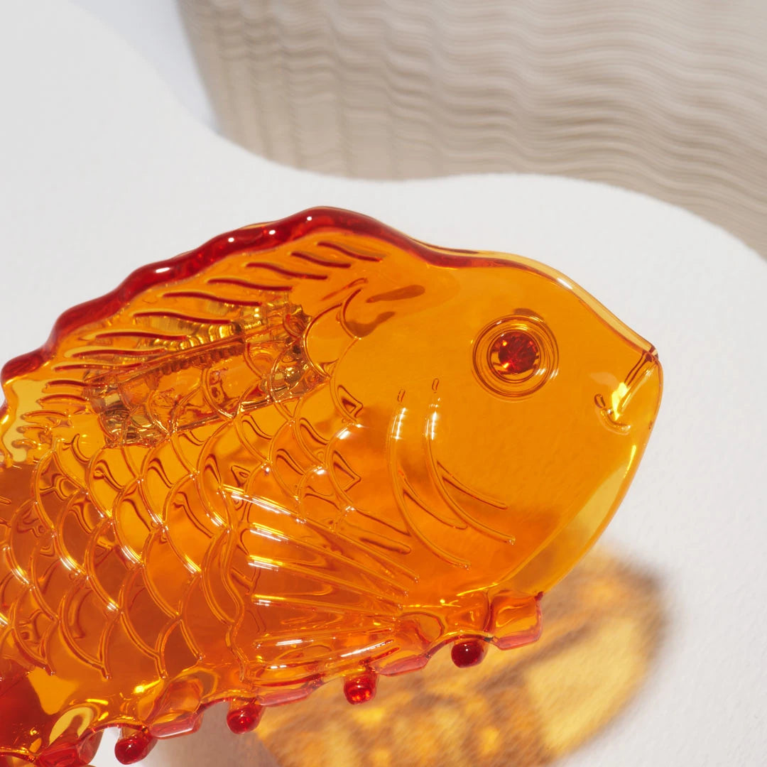Winona Irene Sea Bream Ocean Fish Acetate Hair Claw in clear orange on a white background