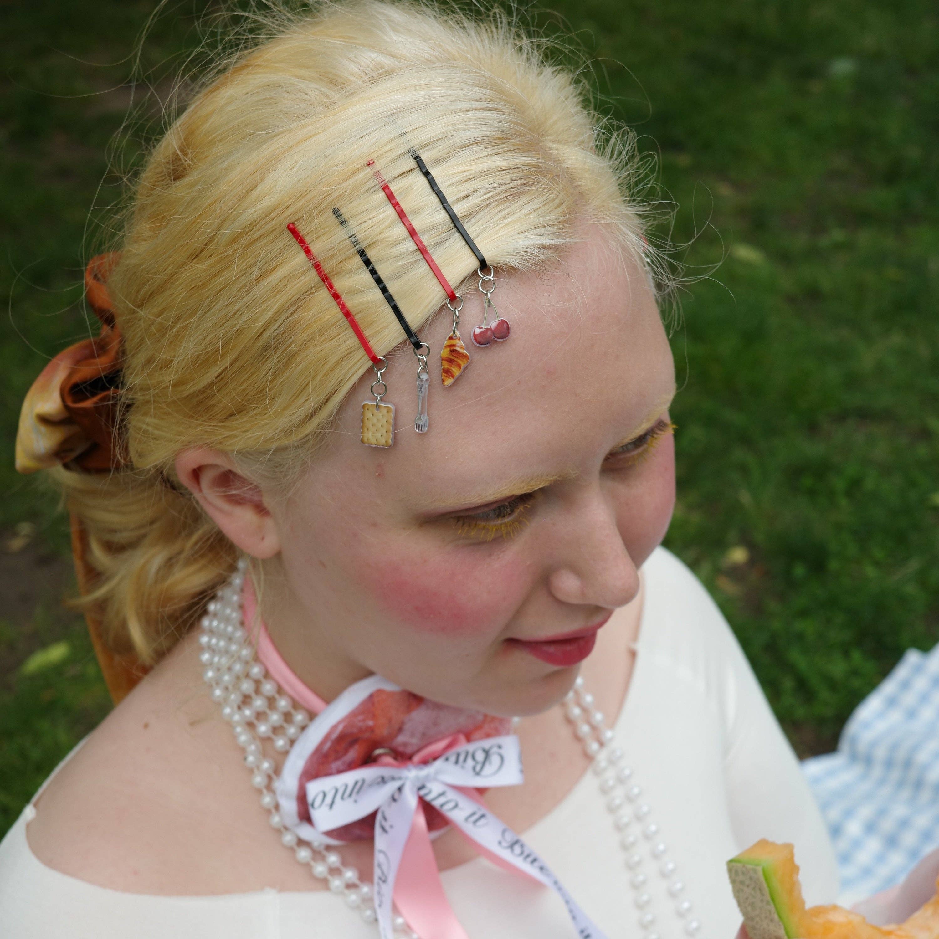 CHUNKS Picnic Bobby Pins being worn by a model against a grassy background