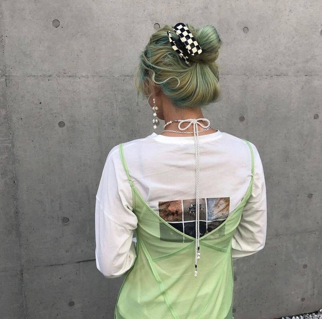 CHUNKS Checker Hair Claw in black and white being worn by a model with green mermaid hair in a loose bun