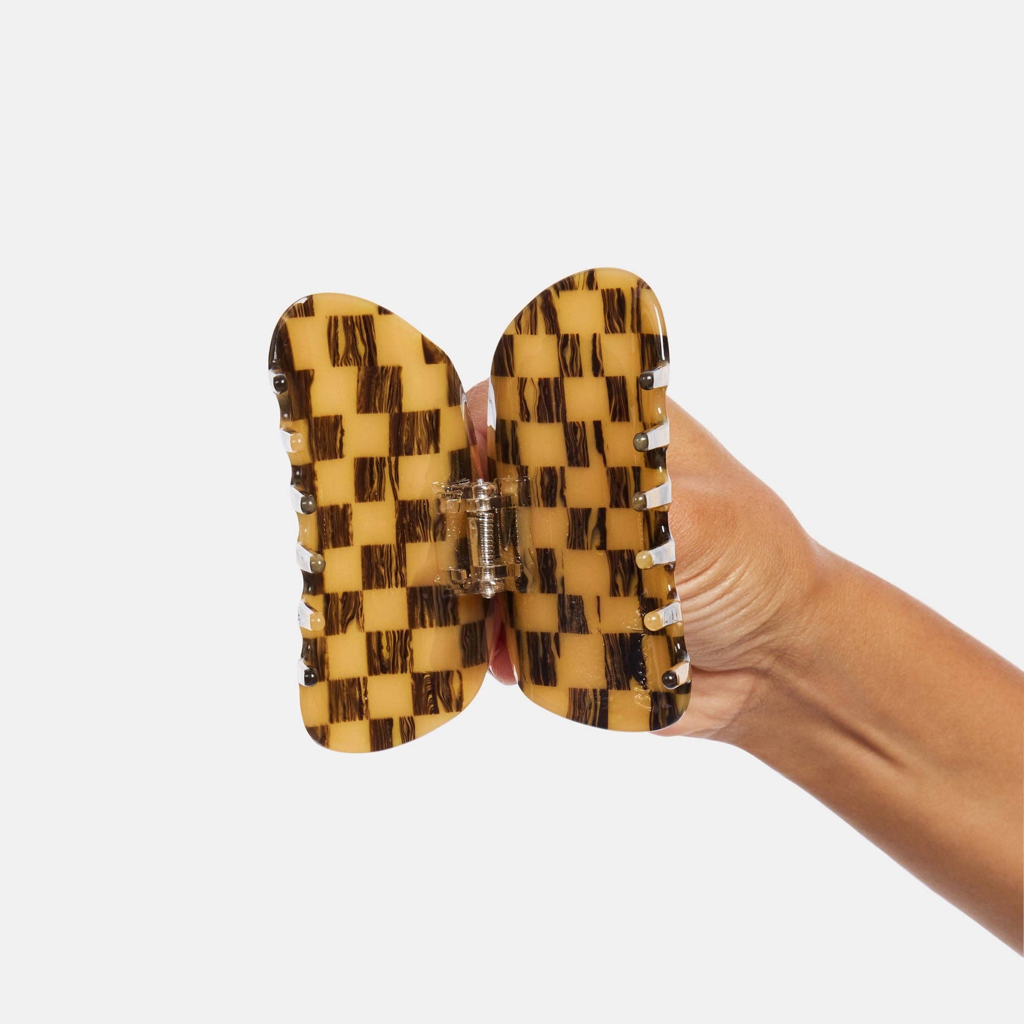 CHUNKS Checker Hair Claw in Mocha being held open by a models hand