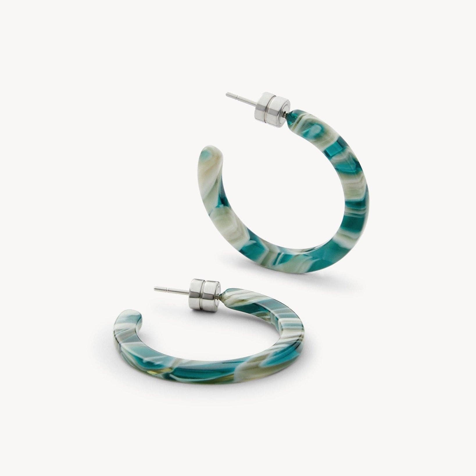 MACHETE Mini Hoops in Stromanthe Acetate flat on a white background at an angle