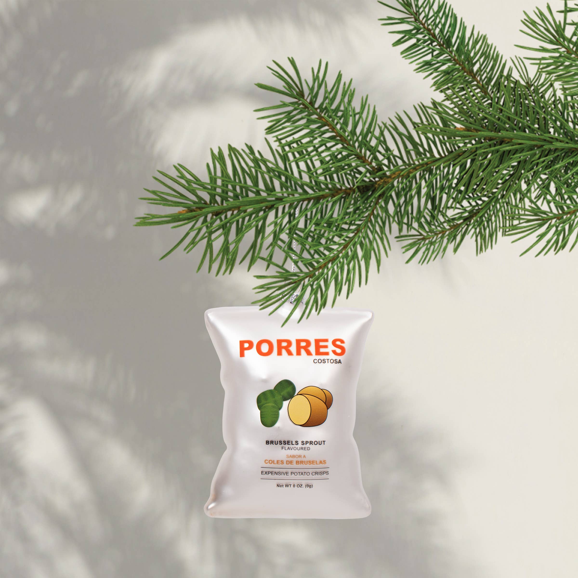 Porres brand package with Brussels sprout illustration against a light background with greenery