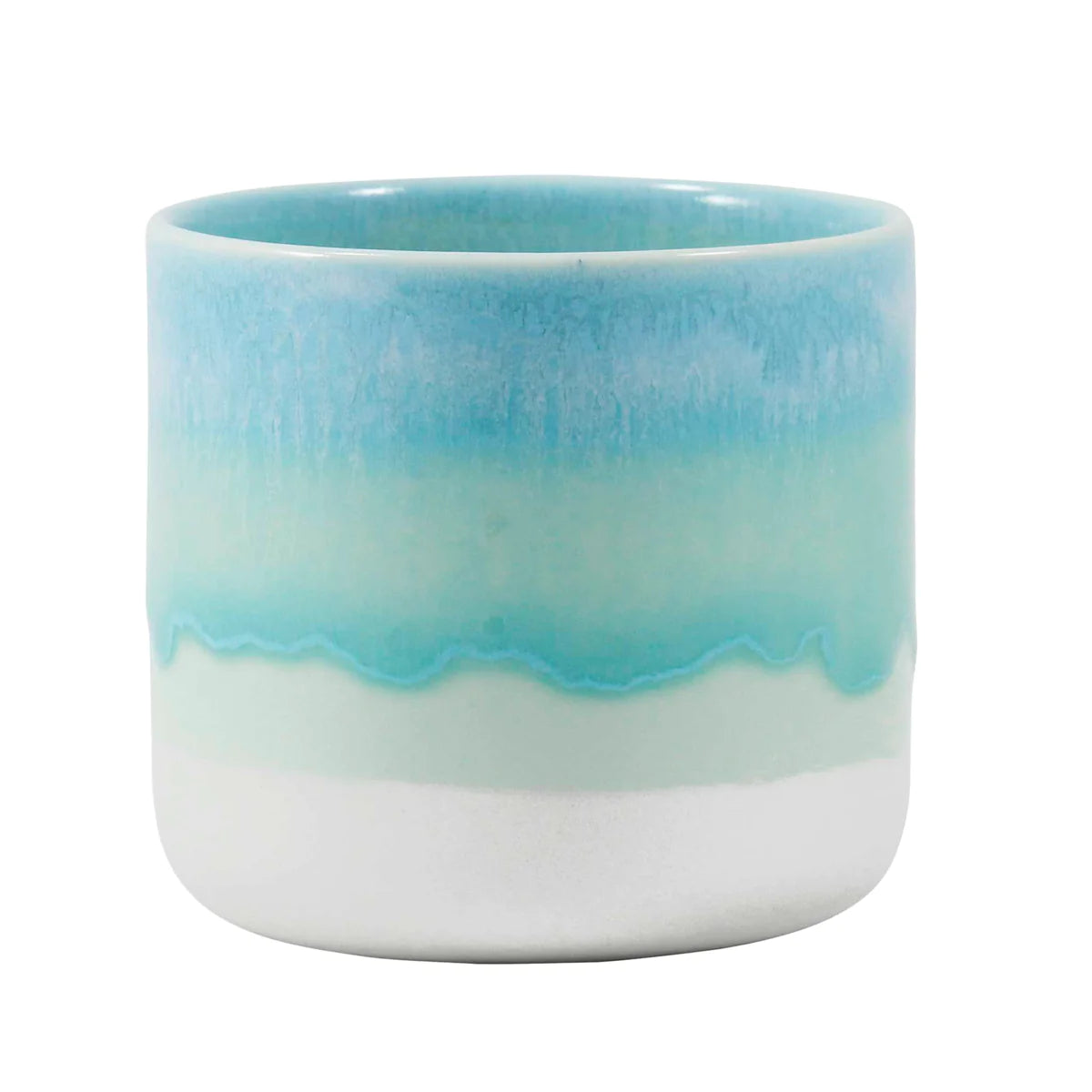 Close up of a white, blue and aqua green handleless cup