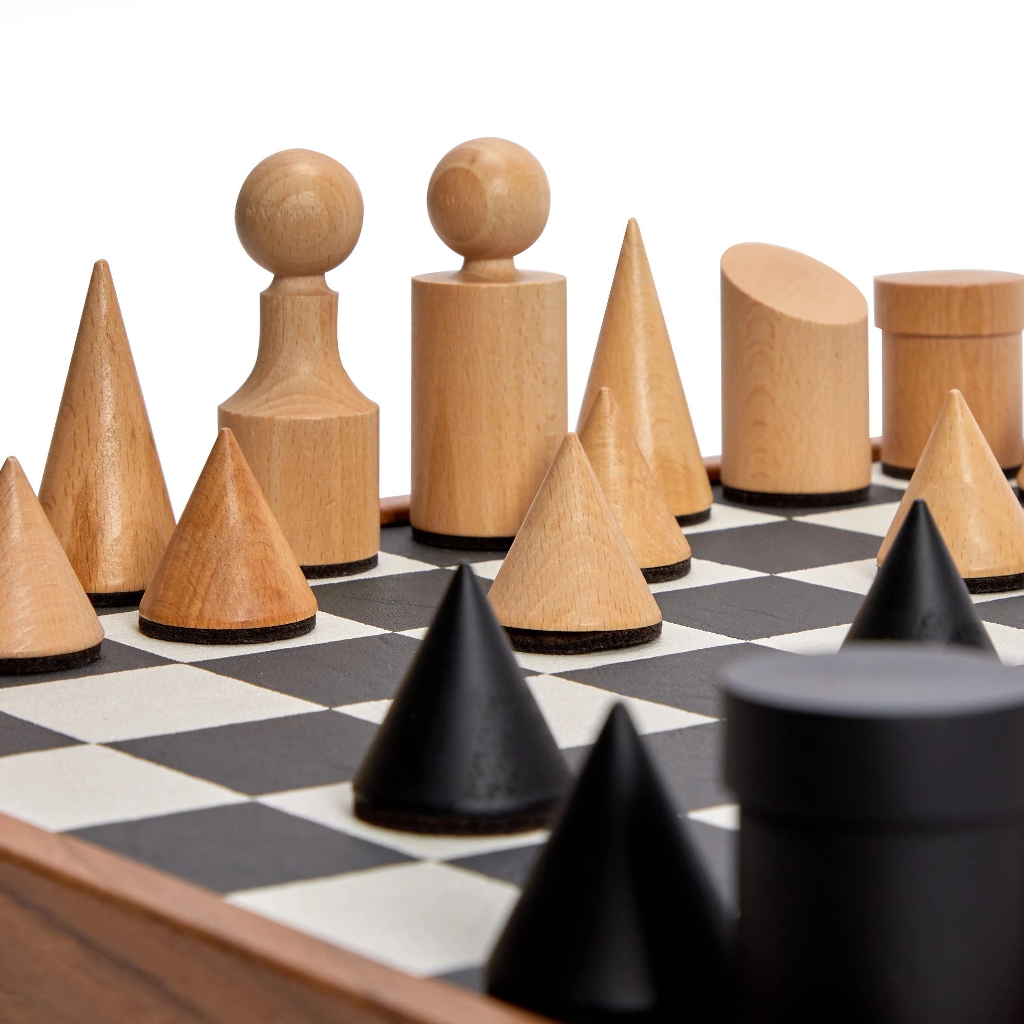 Milos Wooden Chess Set by The Conran Shop in black and white - detail shot of the pieces