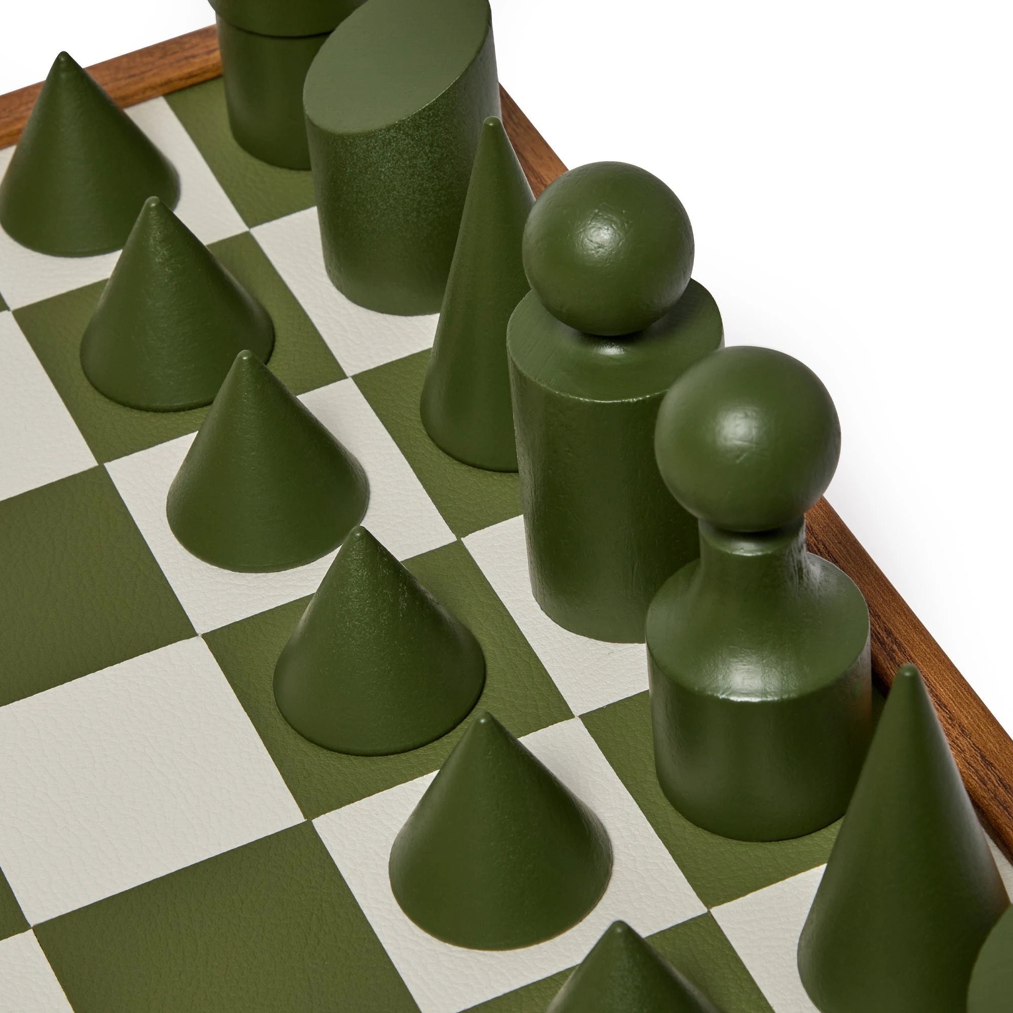 Milos Wooden Chess Set by The Conran Shop in olivine green. Close up of chess pieces