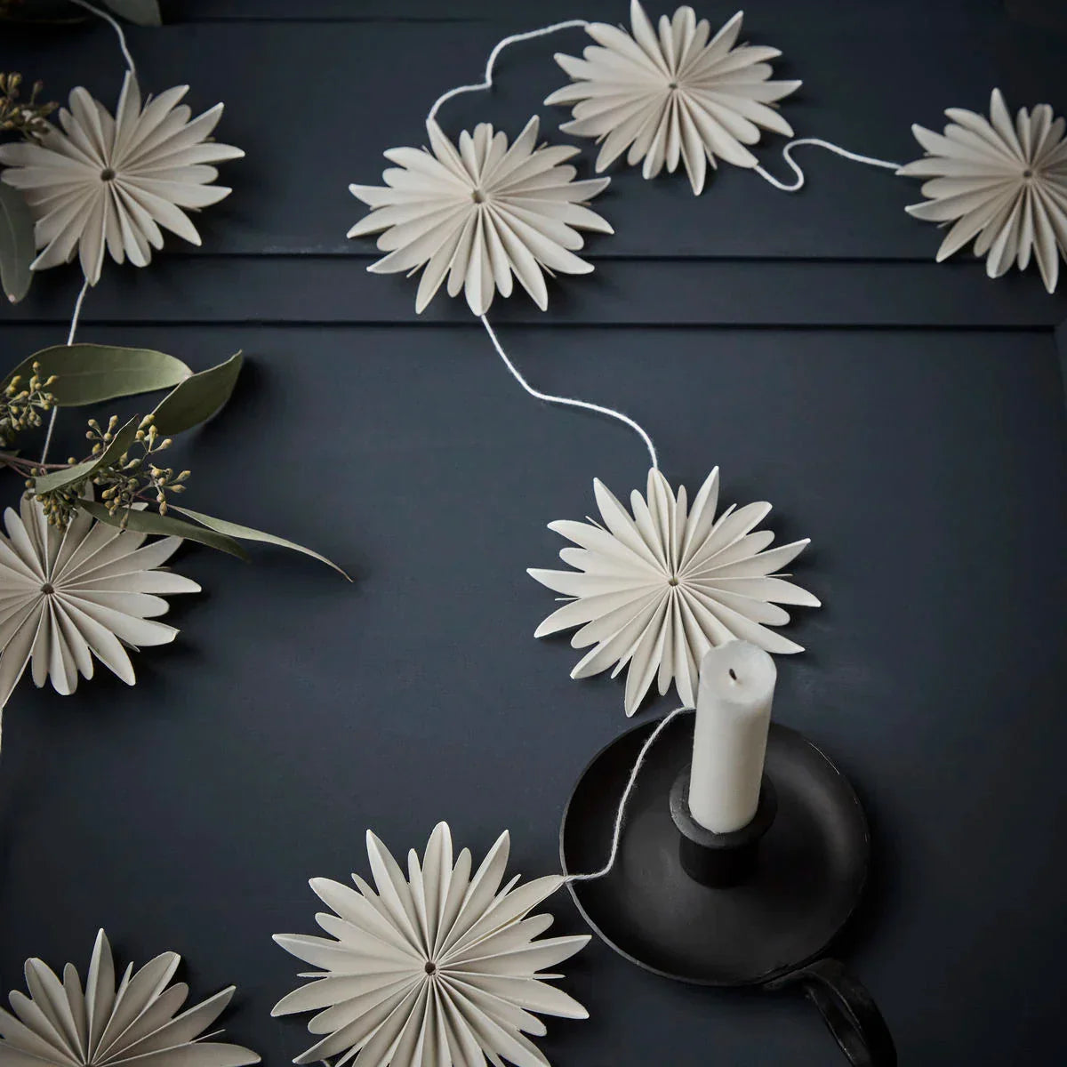 Chritsmas garlands at Lifestory - A string of paper stars on a table