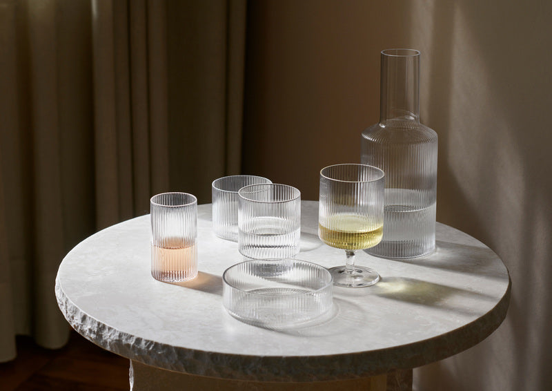fer Living's clear Ripple Collection on a round white marble table