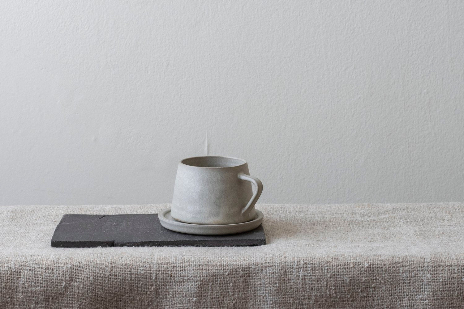 A hand thrown cup and saucer by Borja Moronta available at Lifestory