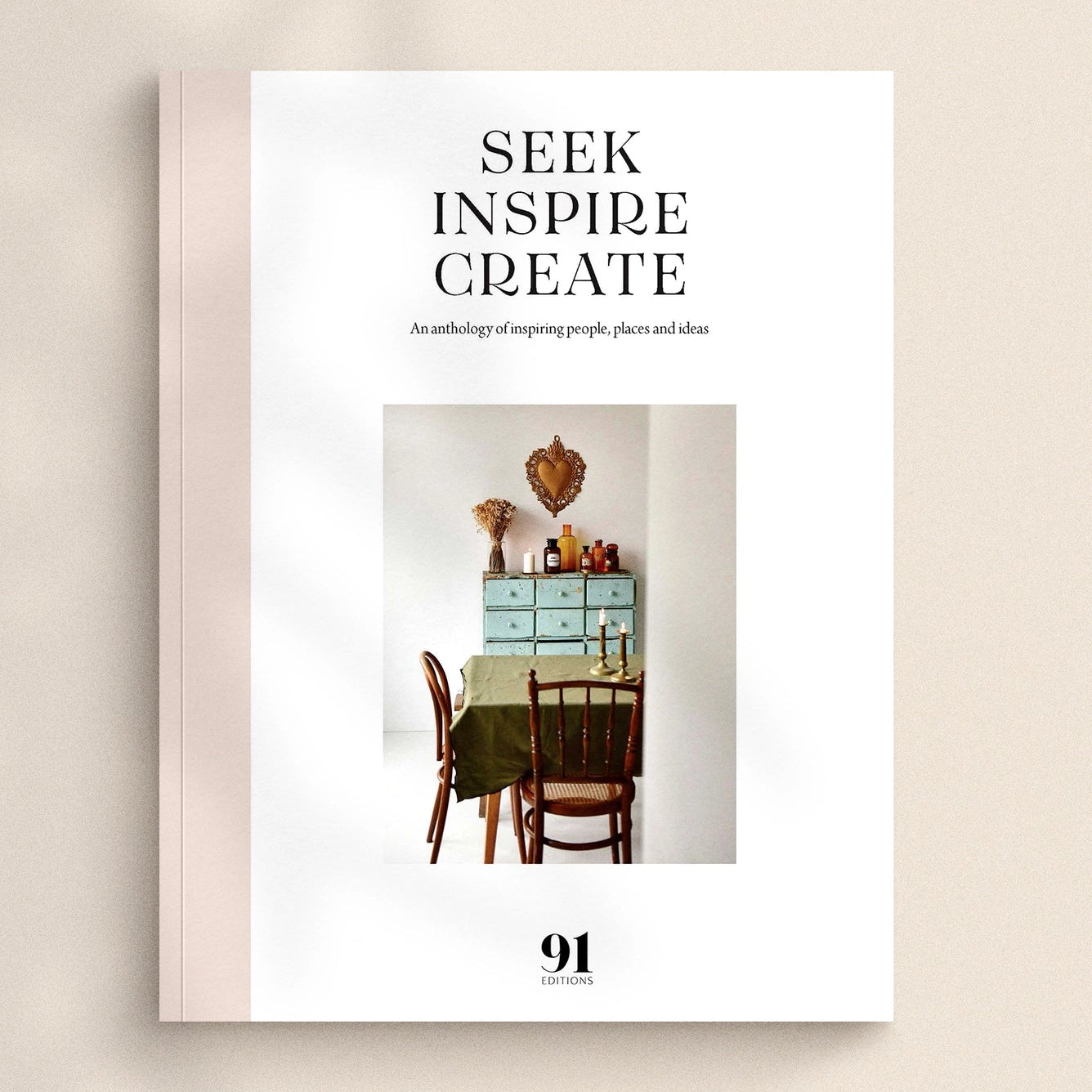 Book cover with 'Seek Inspire Create' text and a photo of a dining room.