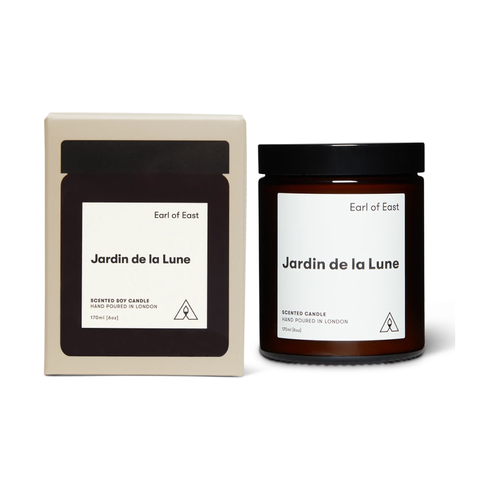 Candle and packaging of 'Jardin de la Lune' by Earl of East on a white background