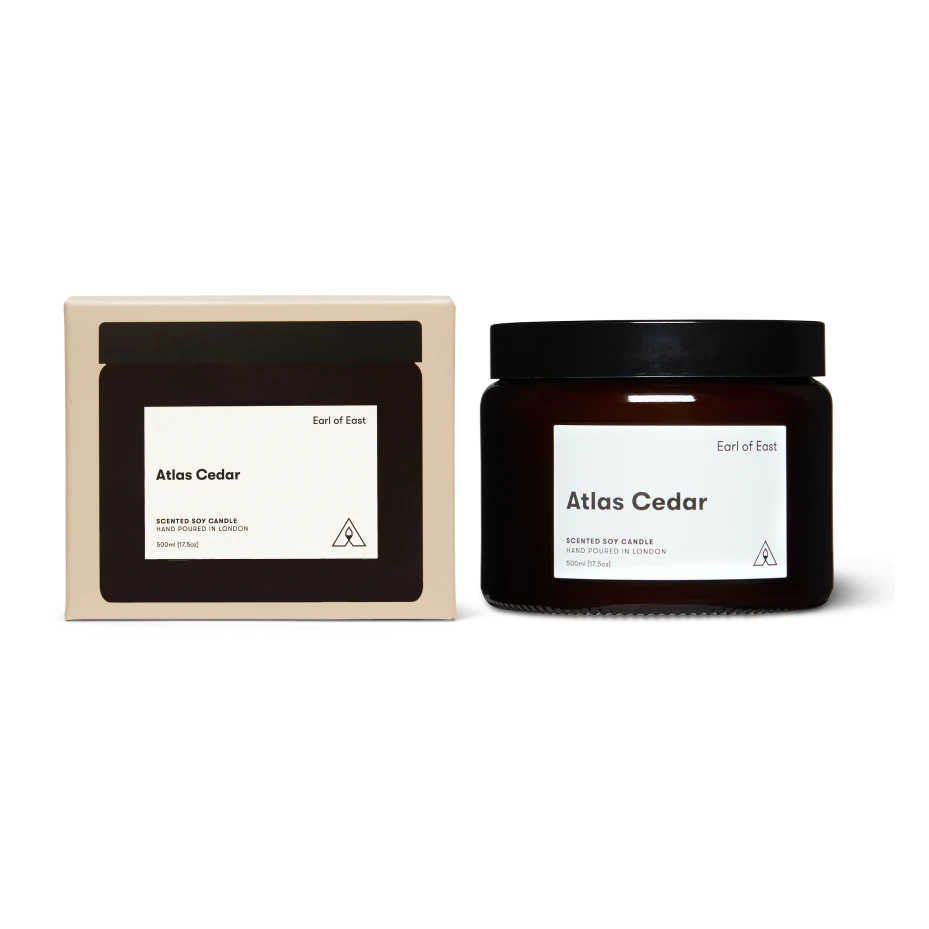 Jar of 'Atlas Cedar' candle with packaging on a white background