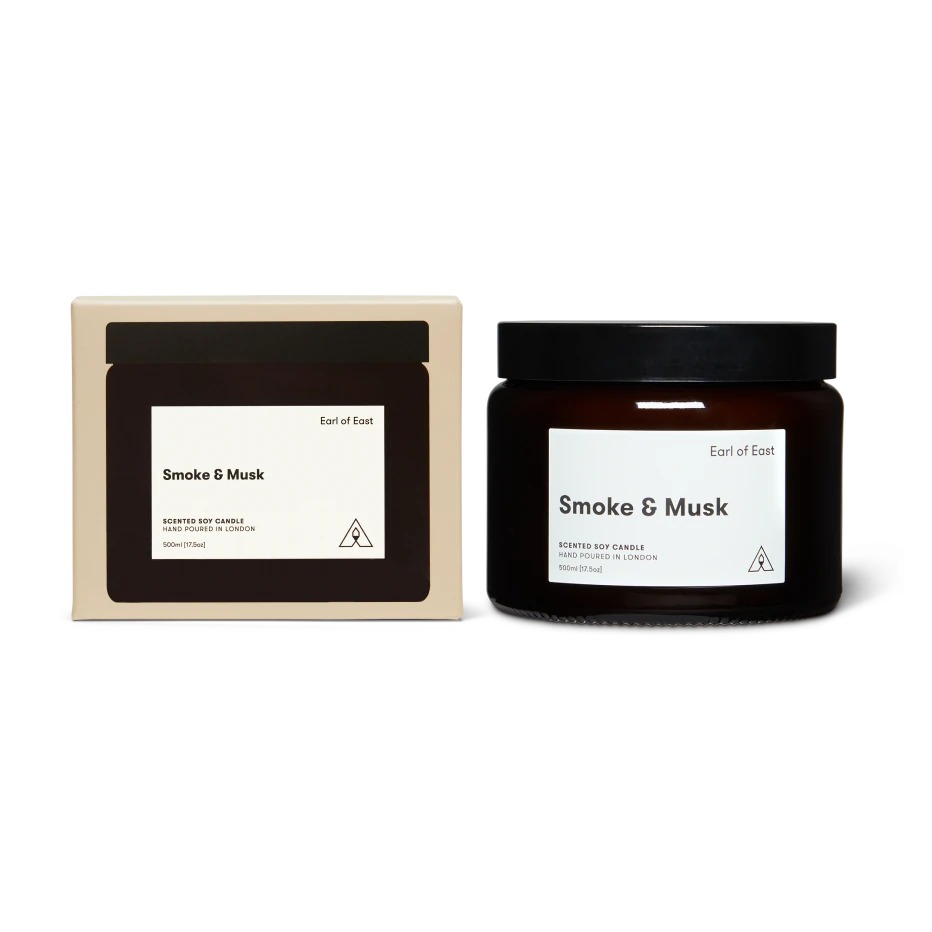 Candle jar and packaging labeled 'Smoke & Musk' on a white background