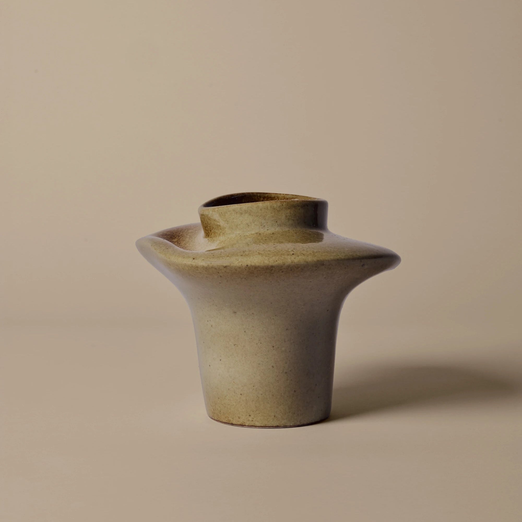 Ceramic vase on a beige background