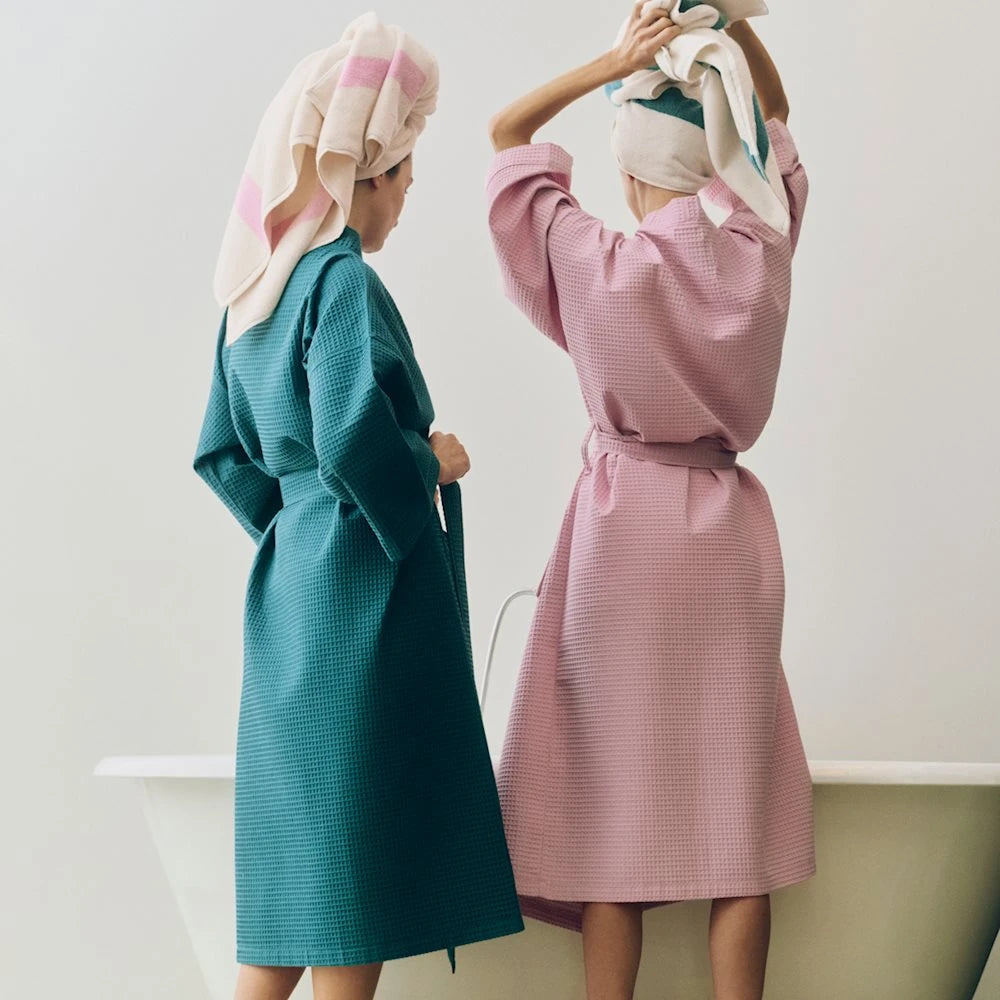 Two models wearing the striped HAY waffle bathrobe.