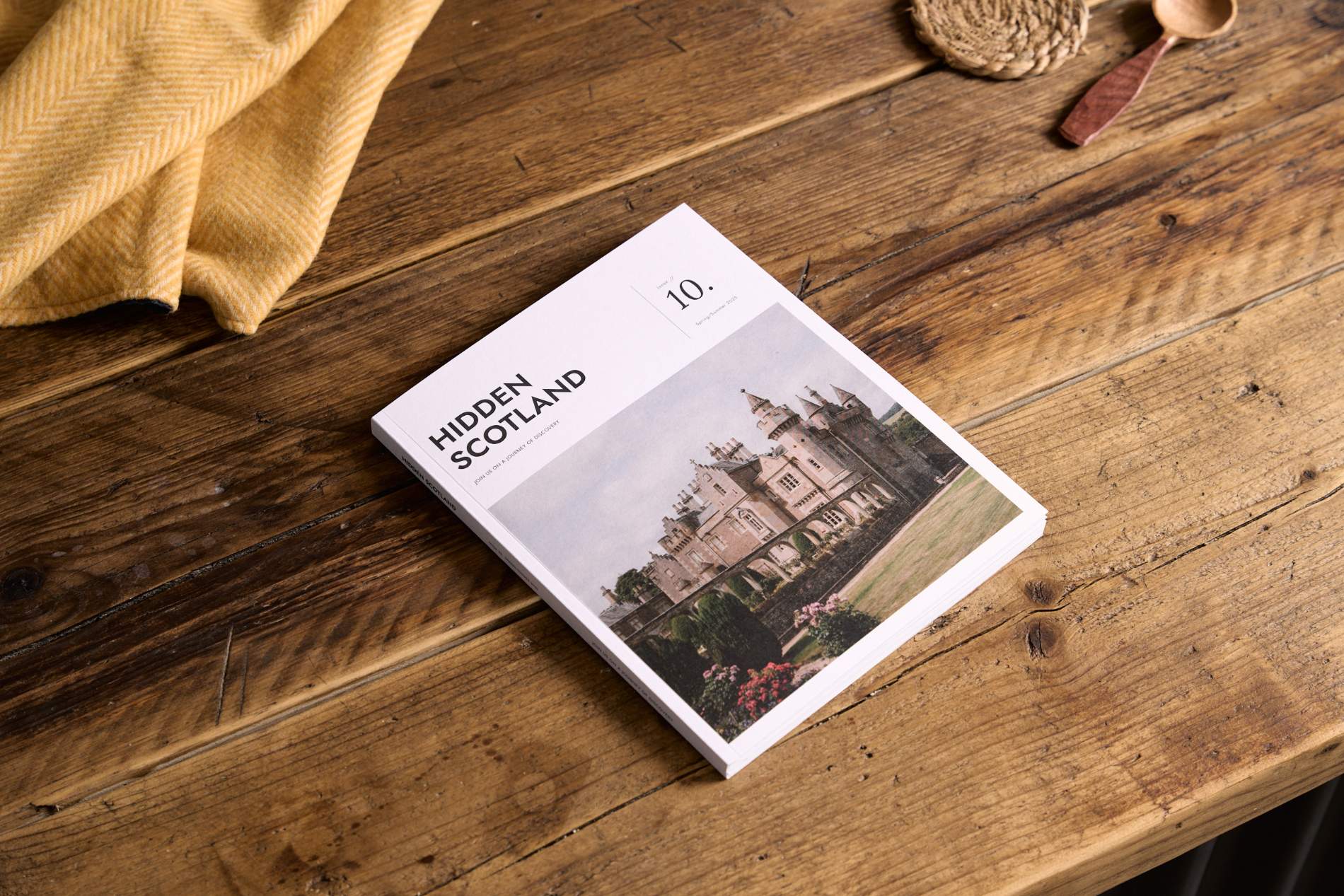 Hidden Scotland Magazine Issue 10 cover on wooden table at Lifestory Store