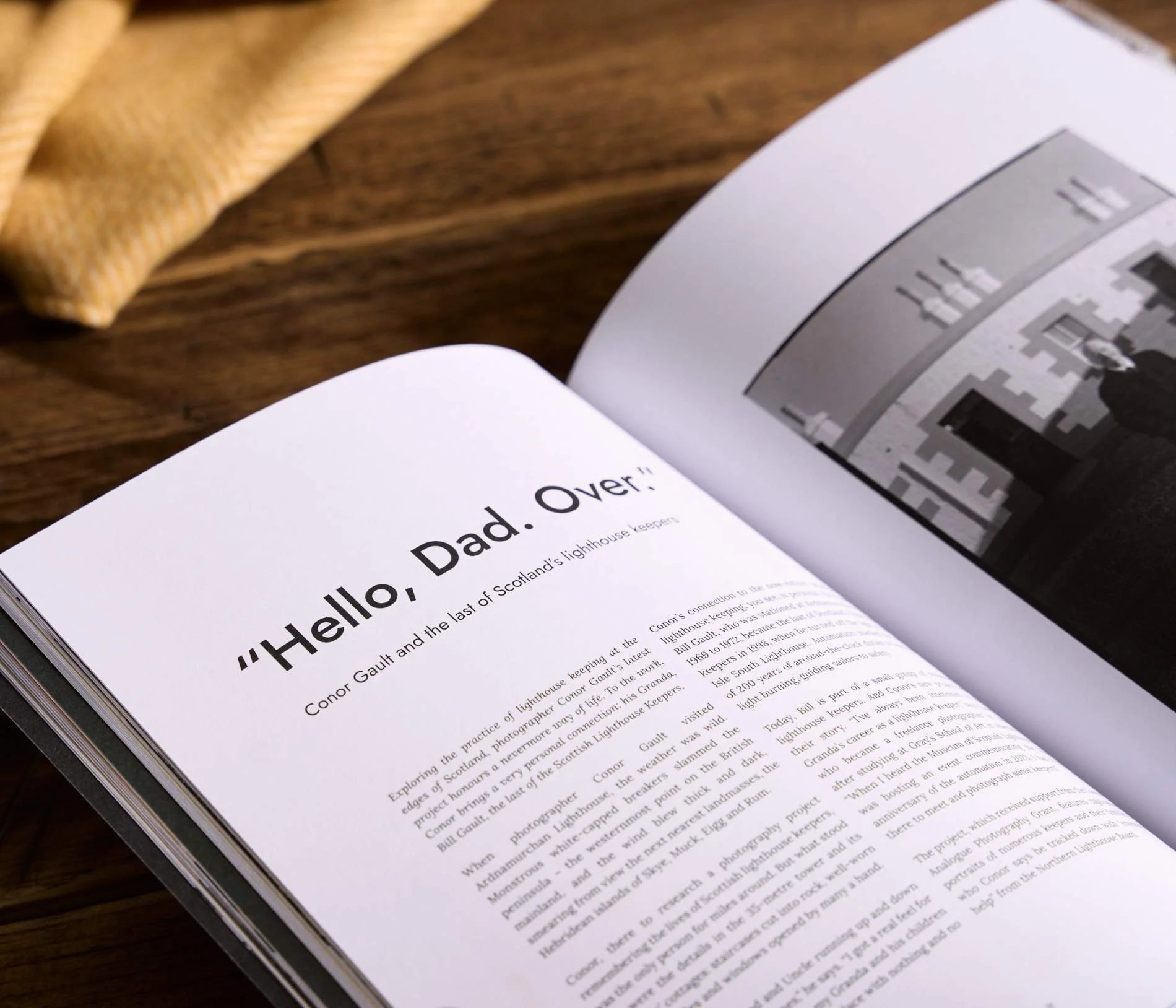 Hidden Scotland Magazine Issue 10 held open up close on a wooden table at Lifestory Store