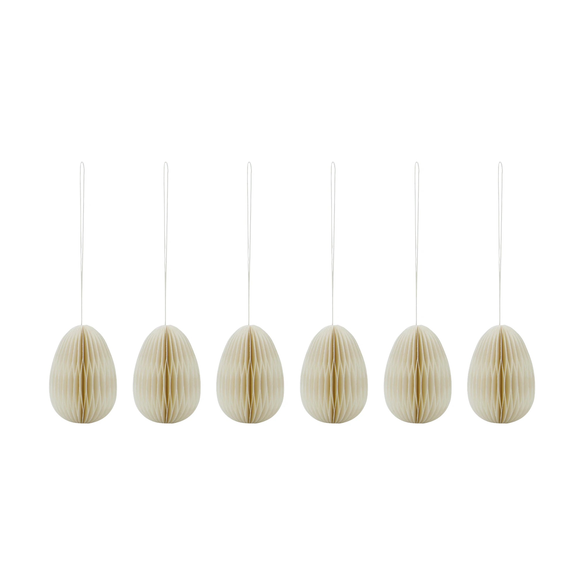 Set of six off-white paper egg-shaped ornaments hanging on a white background