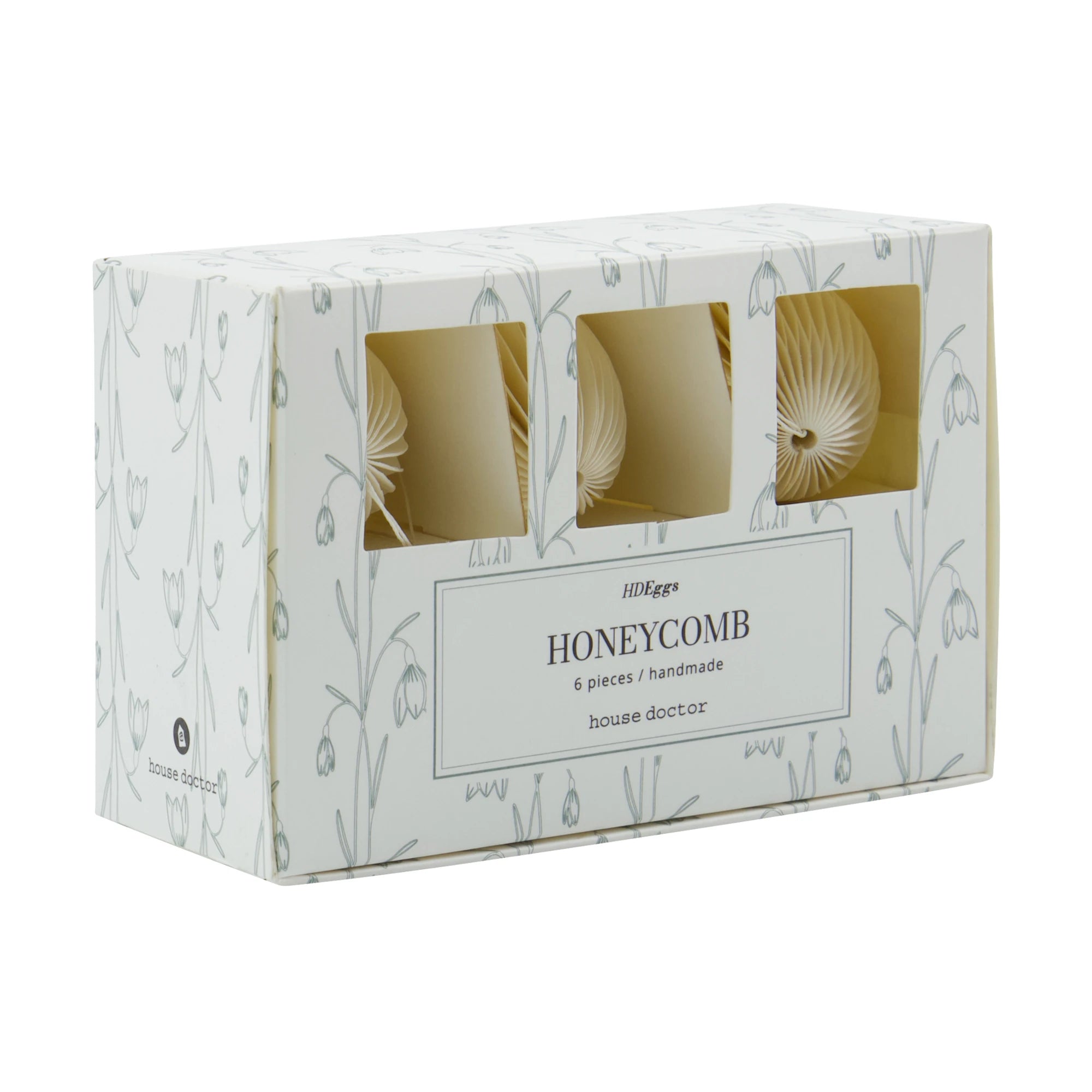 Box of honeycomb paper egg decorations  with 'house doctor' branding on a white background