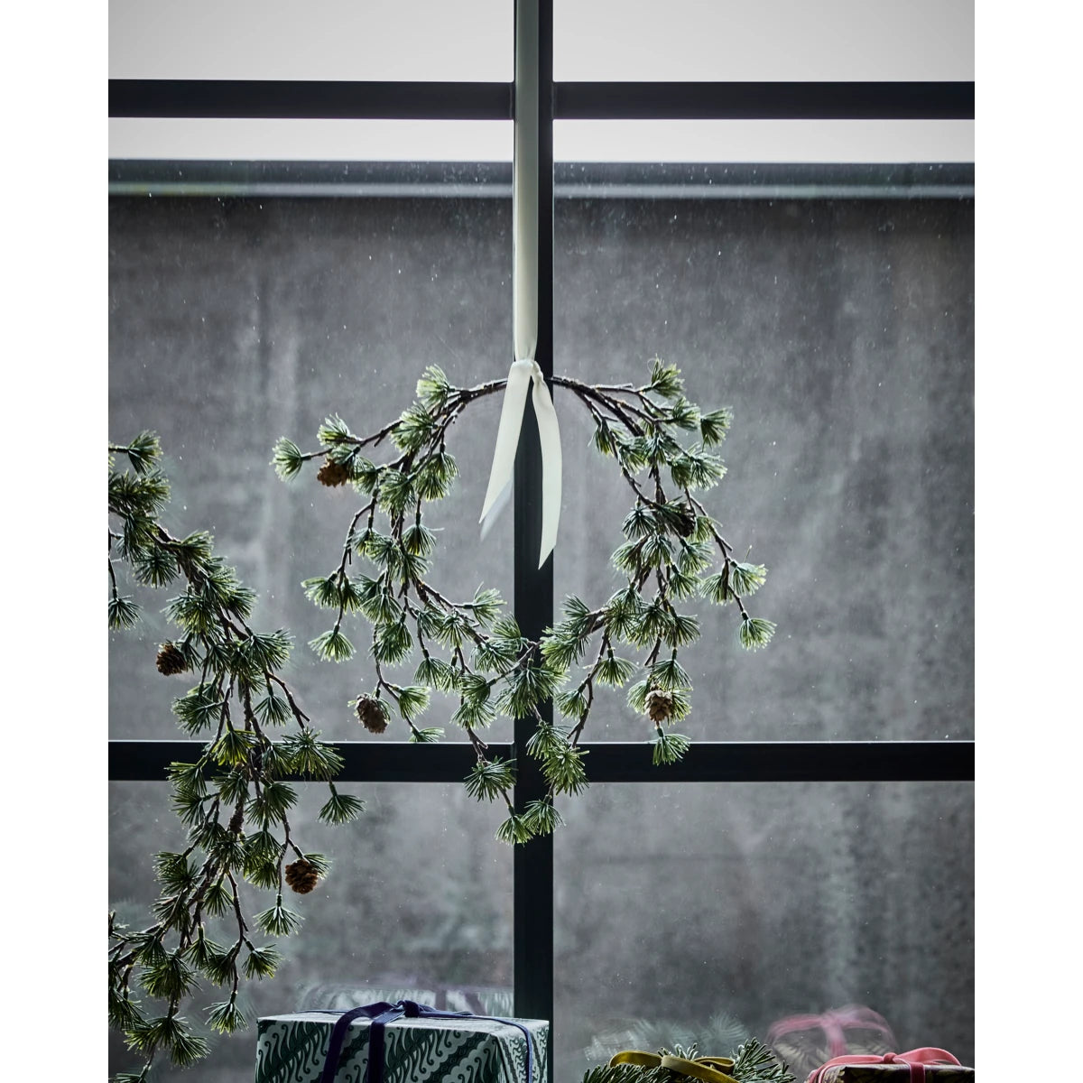 House Doctor 'Torch' Wreath - 30cm hanging from a white ribbon in the window