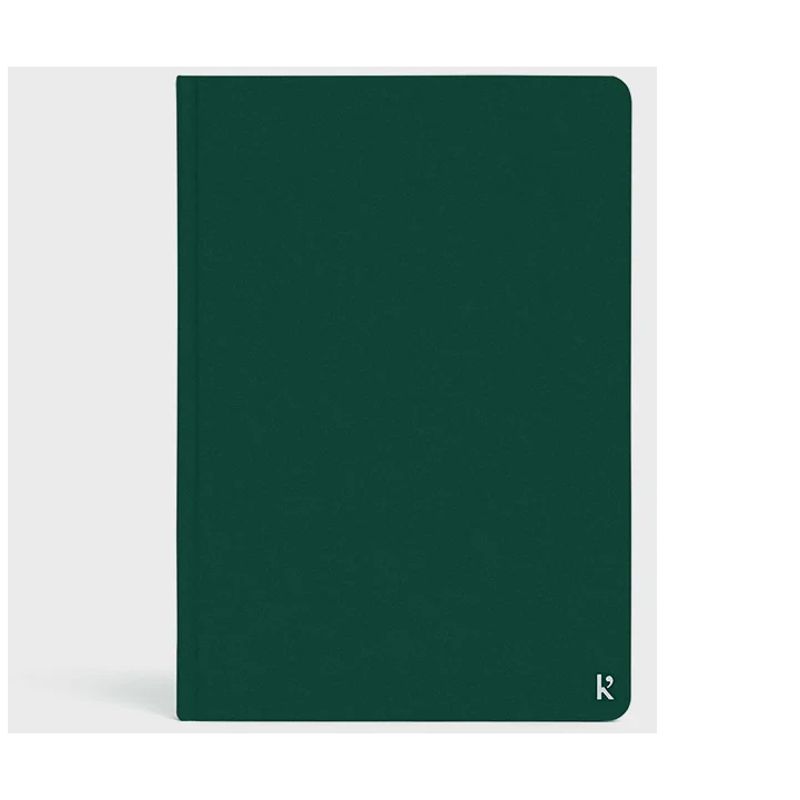 Karst A5 Stone Paper Hardcover Notebook - context image with forest green cover