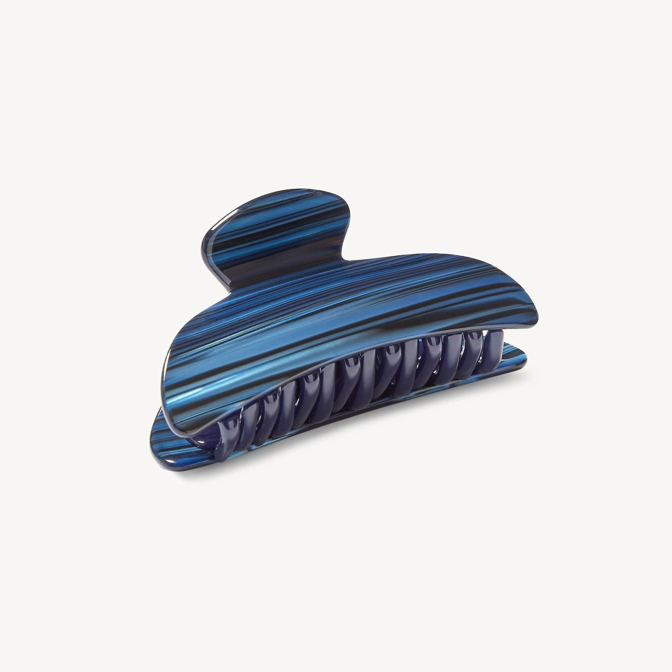 Blue striped hair clip on a white background